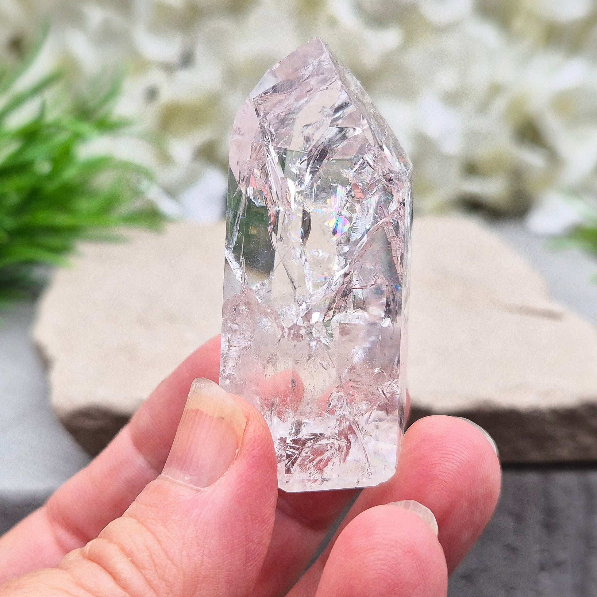 Polished Fire & Ice Quartz point with vibrant internal fractures. Ideal for energy work, meditation and crystal healing. A striking addition to any collection.
