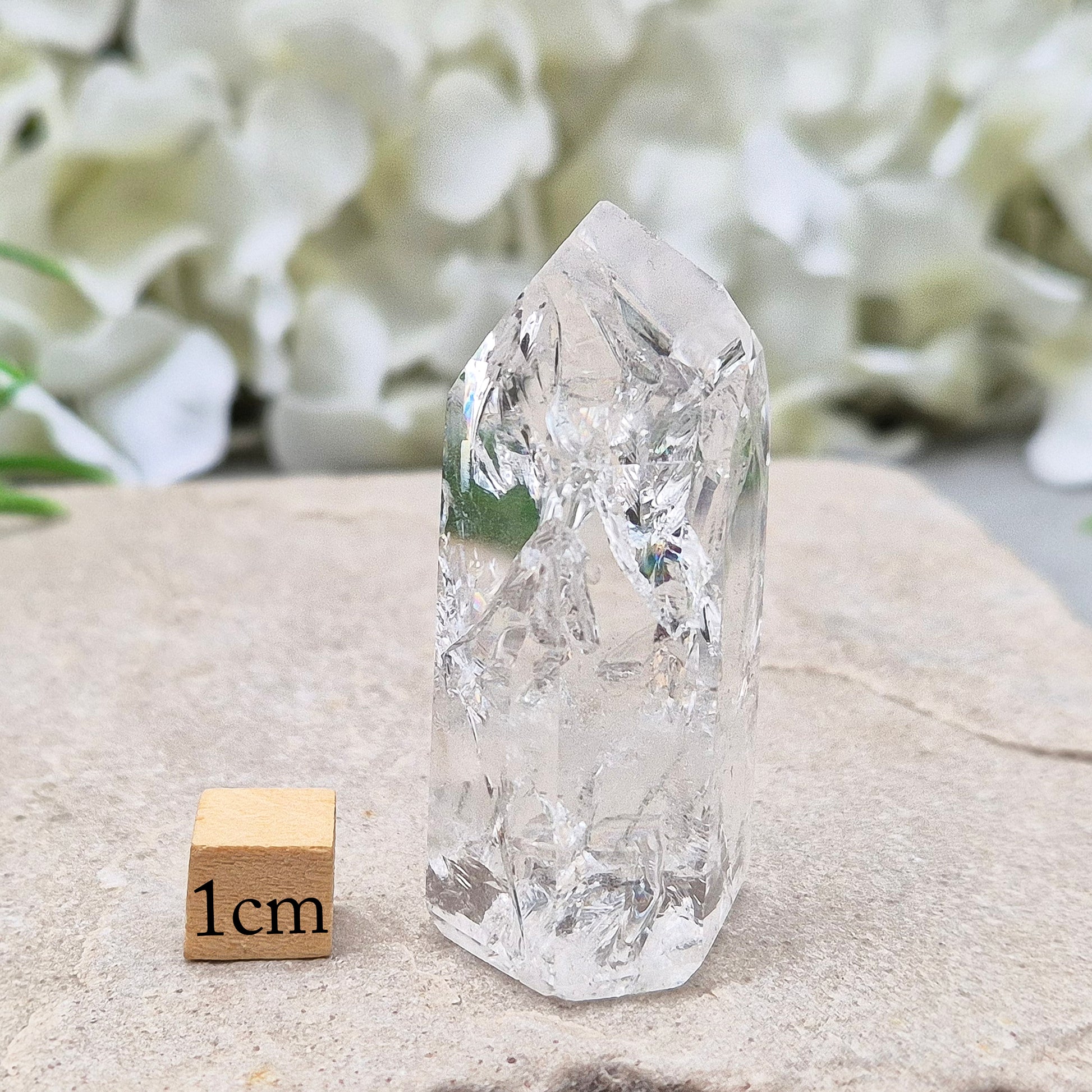 Polished Fire & Ice Quartz point with vibrant internal fractures. Ideal for energy work, meditation and crystal healing. A striking addition to any collection.