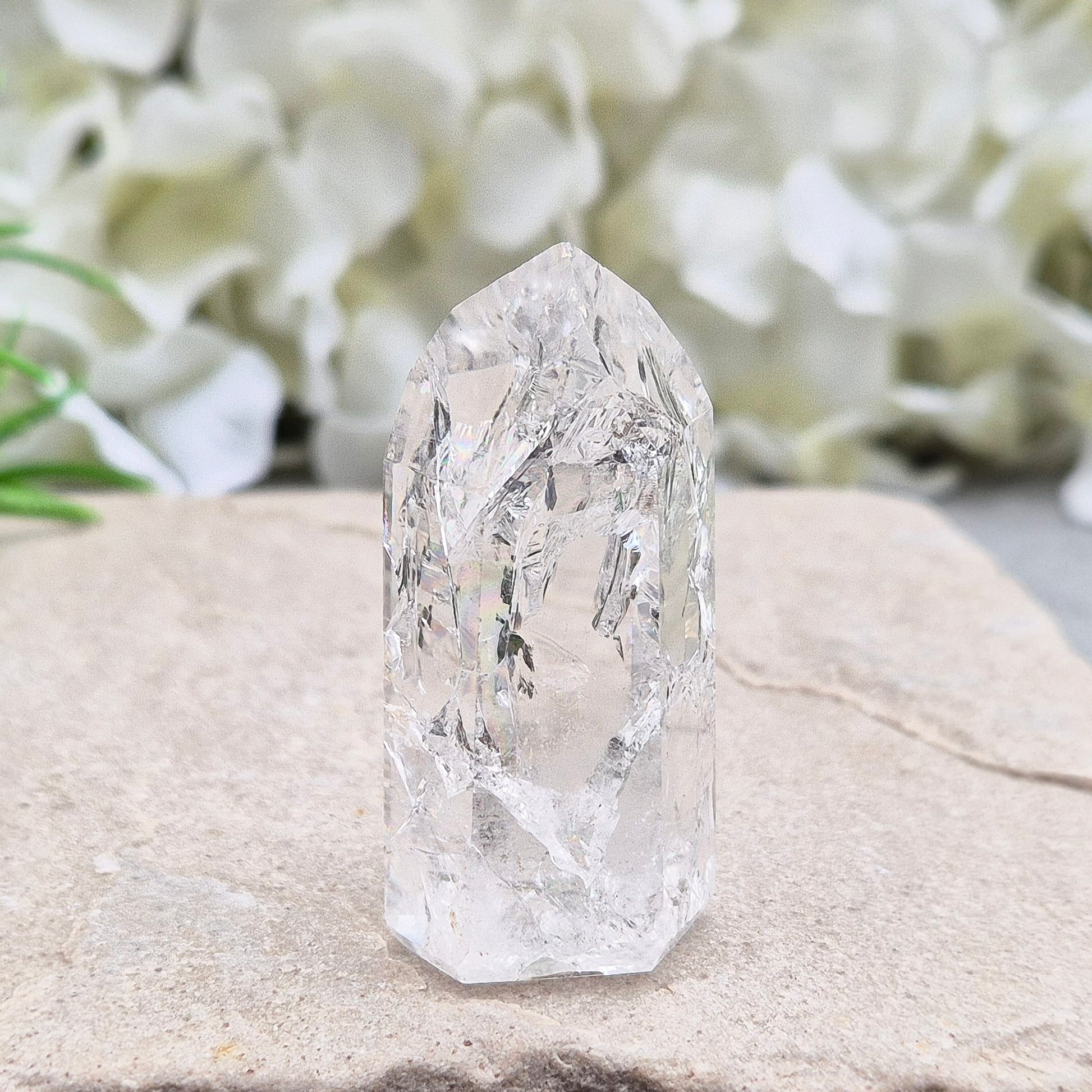 Polished Fire & Ice Quartz point with vibrant internal fractures. Ideal for energy work, meditation and crystal healing. A striking addition to any collection.