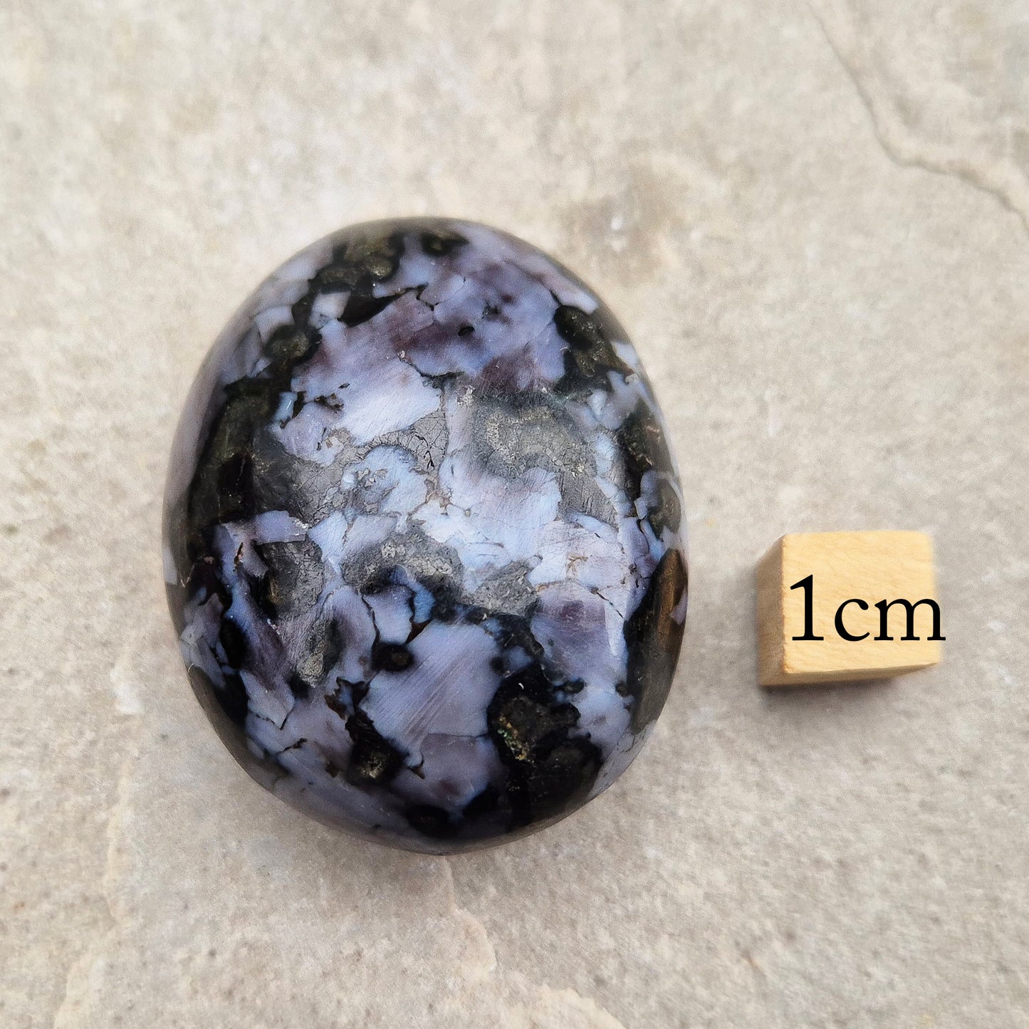 Indigo Gabbro palm stone for grounding, balancing energy, and supporting emotional awareness. Smooth, polished, perfect for meditation or holding.