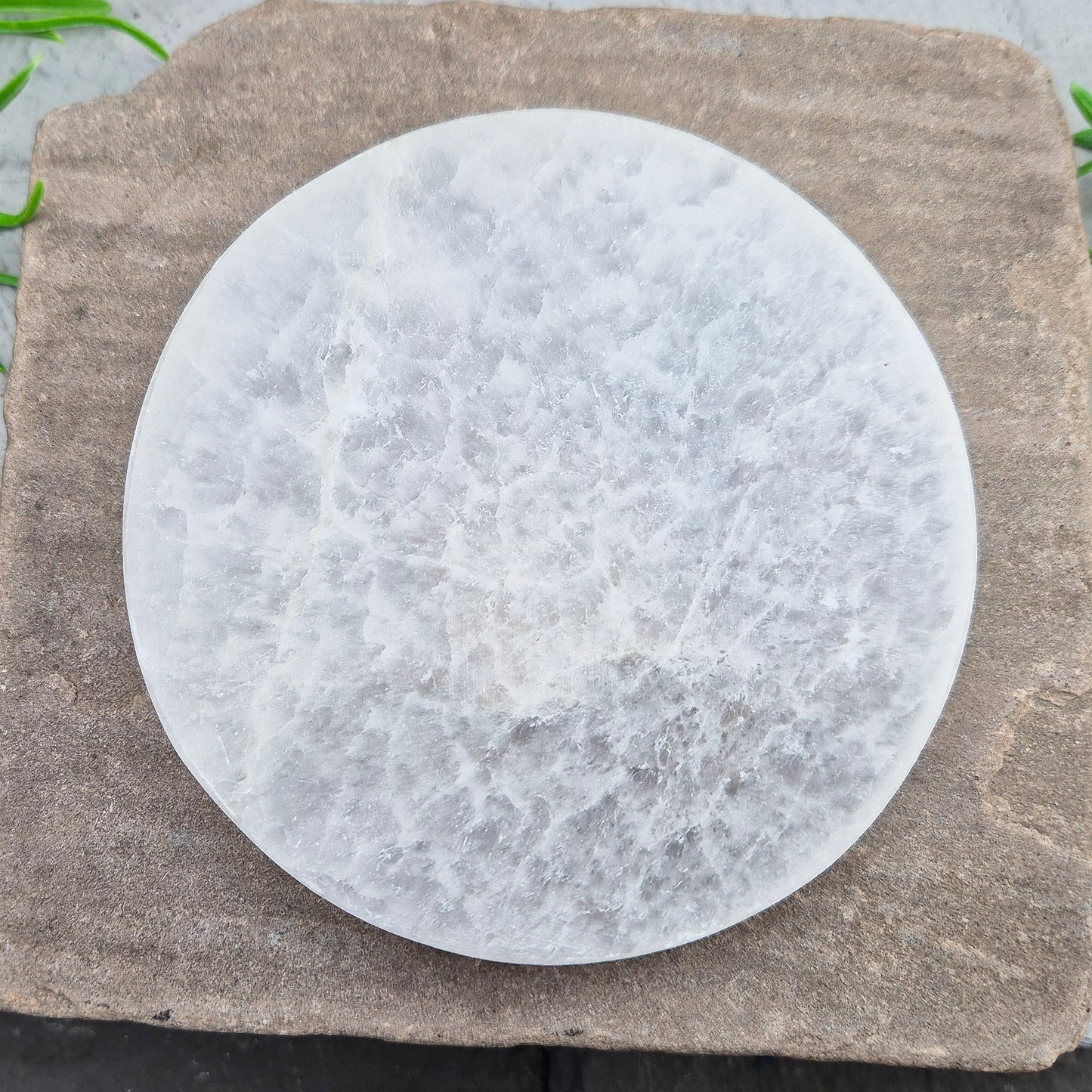 Polished Selenite charging plate that clears heavy energy and recharges your crystals. Ideal for daily cleansing.