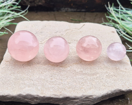 Elevate your space with a Rose Quartz crystal sphere/crystal ball. Enhance love, harmony, and emotional support. Perfect for meditation and decor. 
