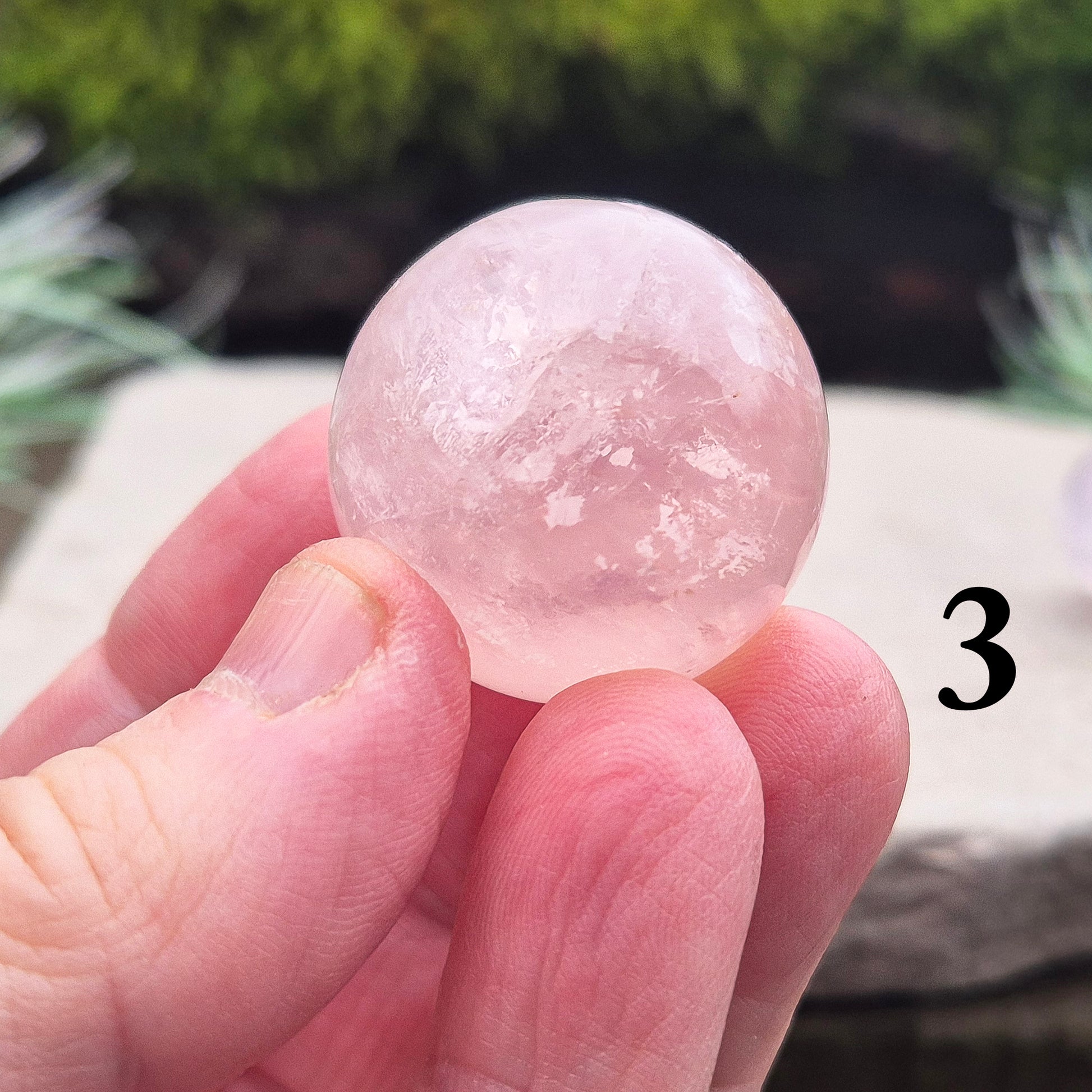 Elevate your space with a Rose Quartz crystal sphere/crystal ball. Enhance love, harmony, and emotional support. Perfect for meditation and decor. 