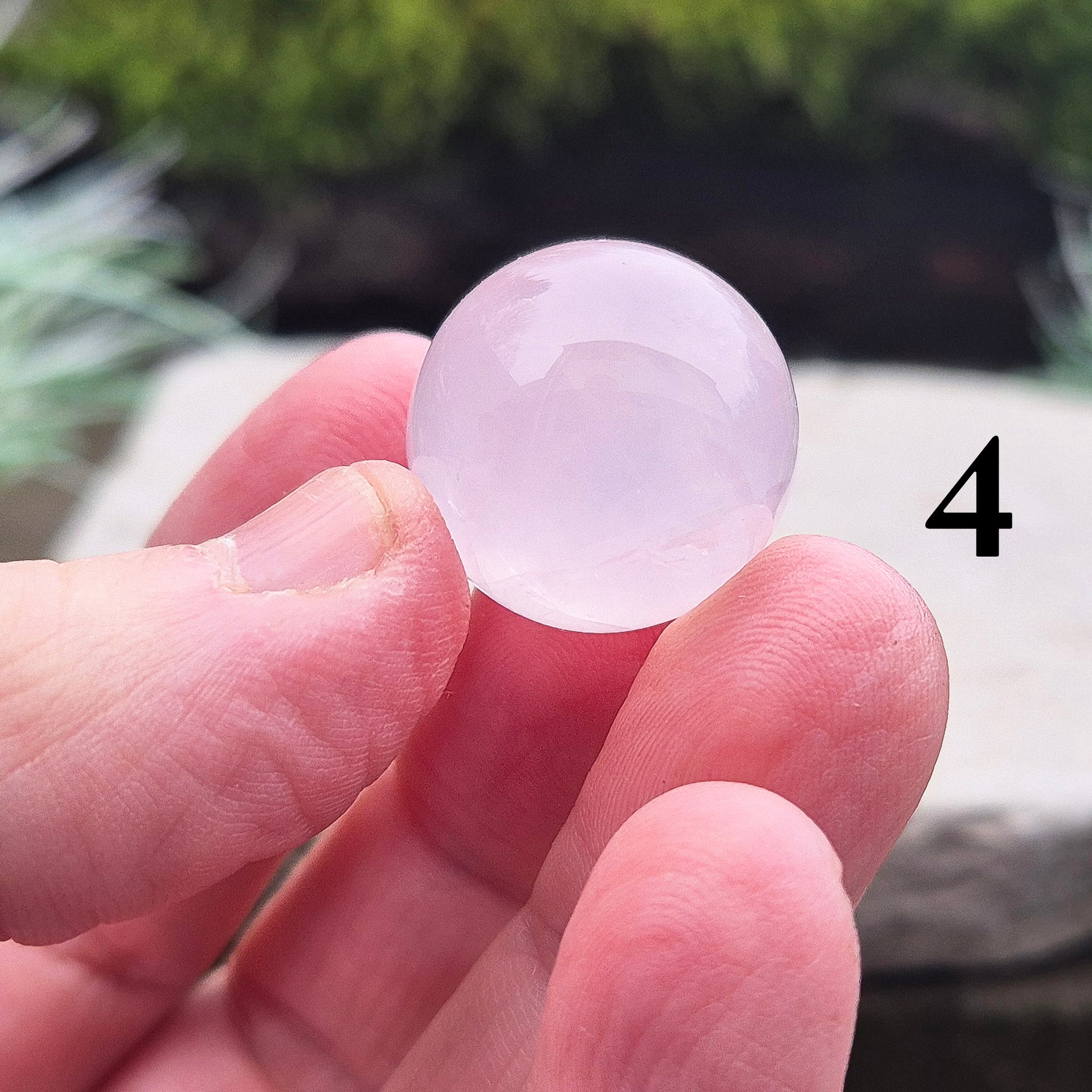 Elevate your space with a Rose Quartz crystal sphere/crystal ball. Enhance love, harmony, and emotional support. Perfect for meditation and decor. 