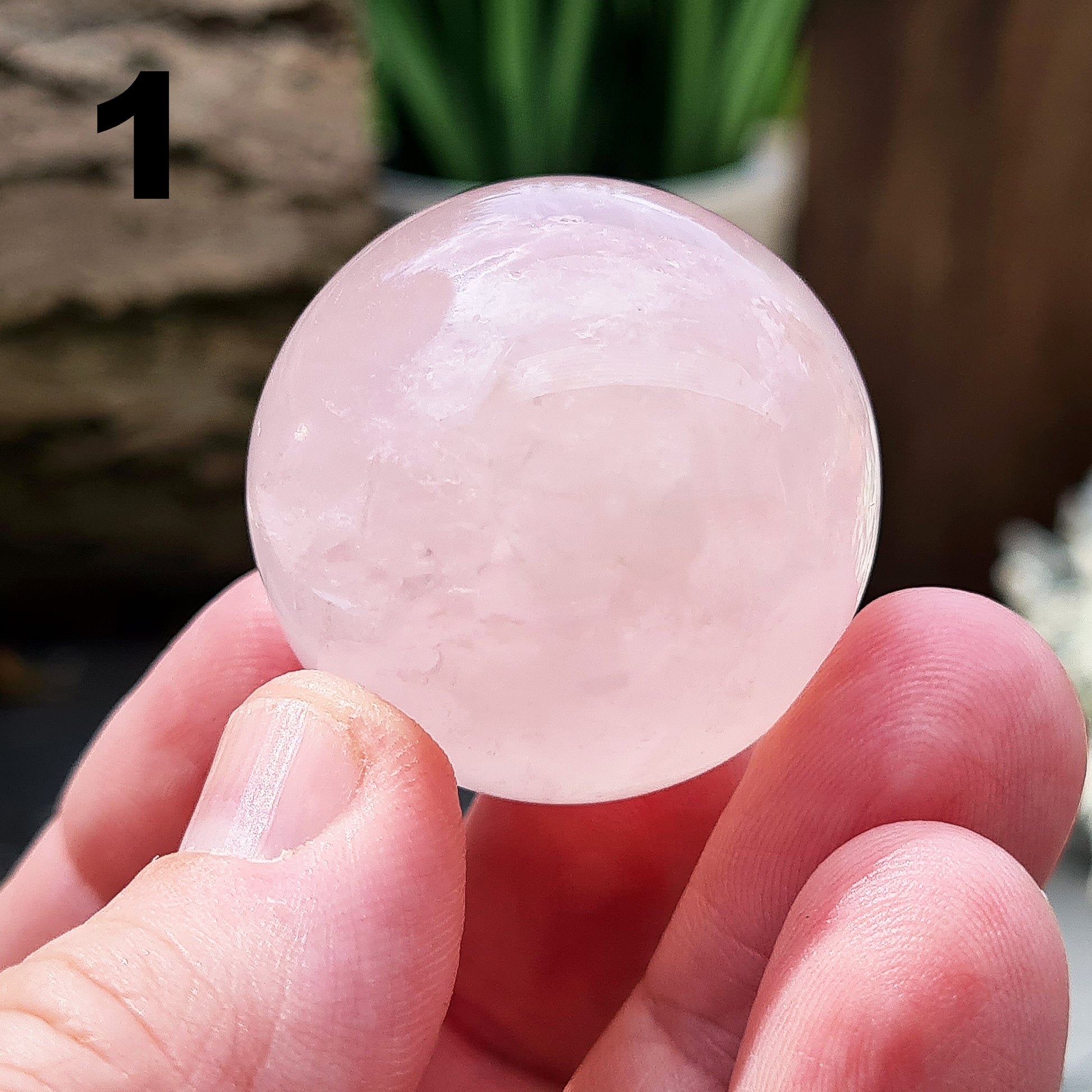 Elevate your space with a Rose Quartz crystal sphere/crystal ball. Enhance love, harmony, and emotional support. Perfect for meditation and decor. 