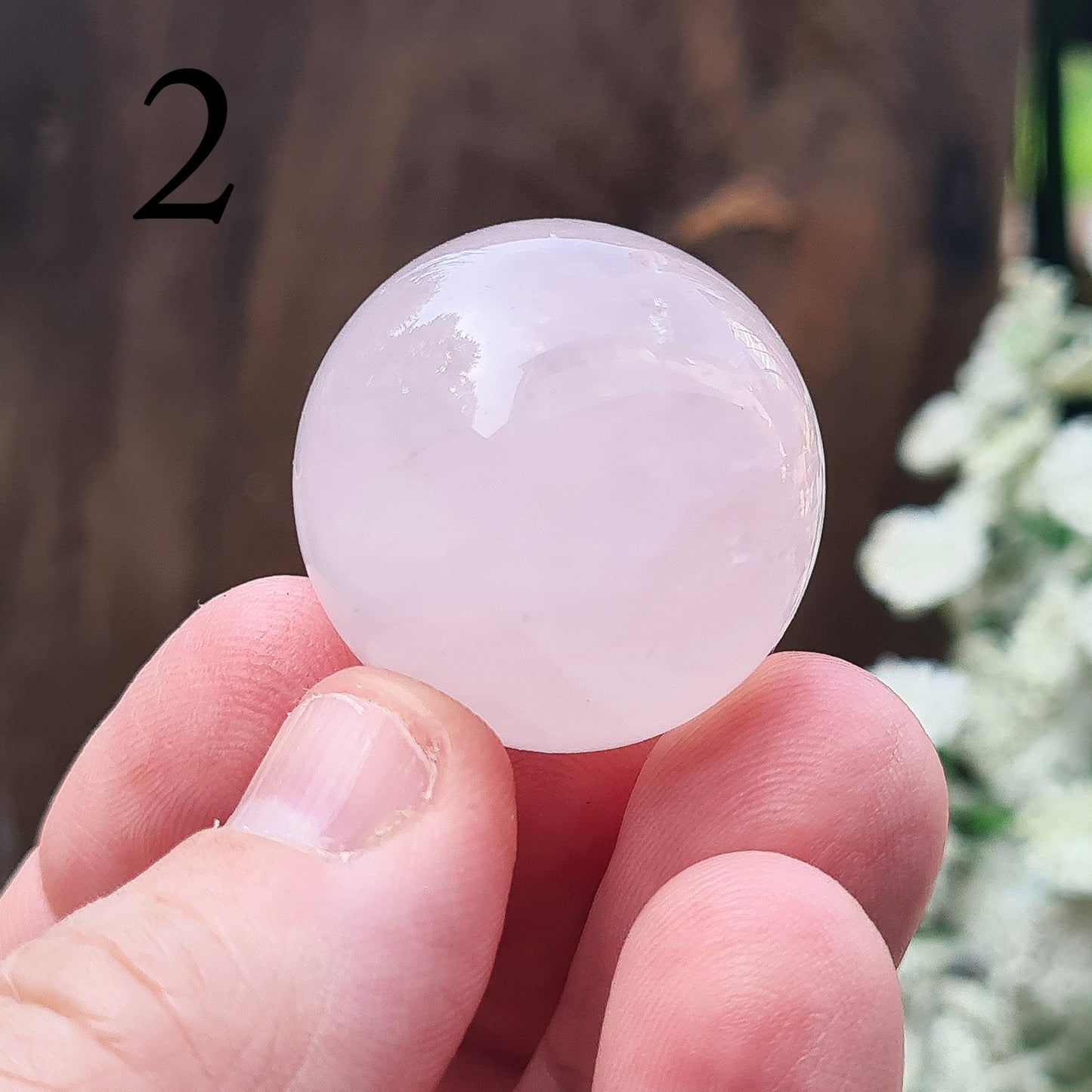 Elevate your space with a Rose Quartz crystal sphere/crystal ball. Enhance love, harmony, and emotional support. Perfect for meditation and decor. 