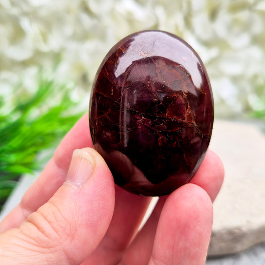 Natural Almandine-Pyrope Star Garnet palm stone. Sparkling, rare, and ideal for meditation, energy work, or display.
