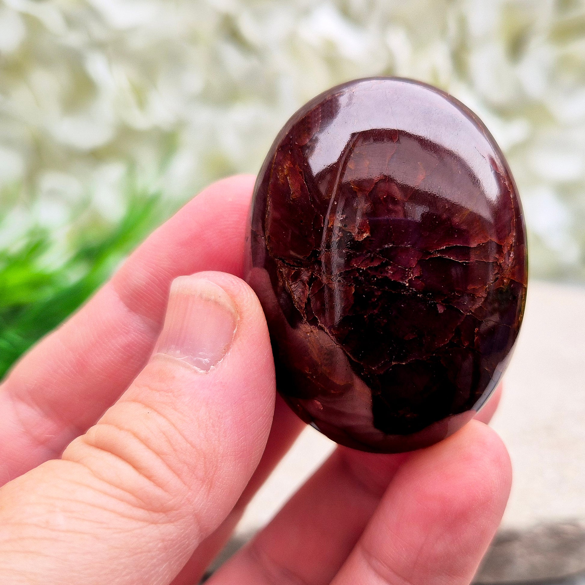 Natural Almandine-Pyrope Star Garnet palm stone. Sparkling, rare, and ideal for meditation, energy work, or display.
