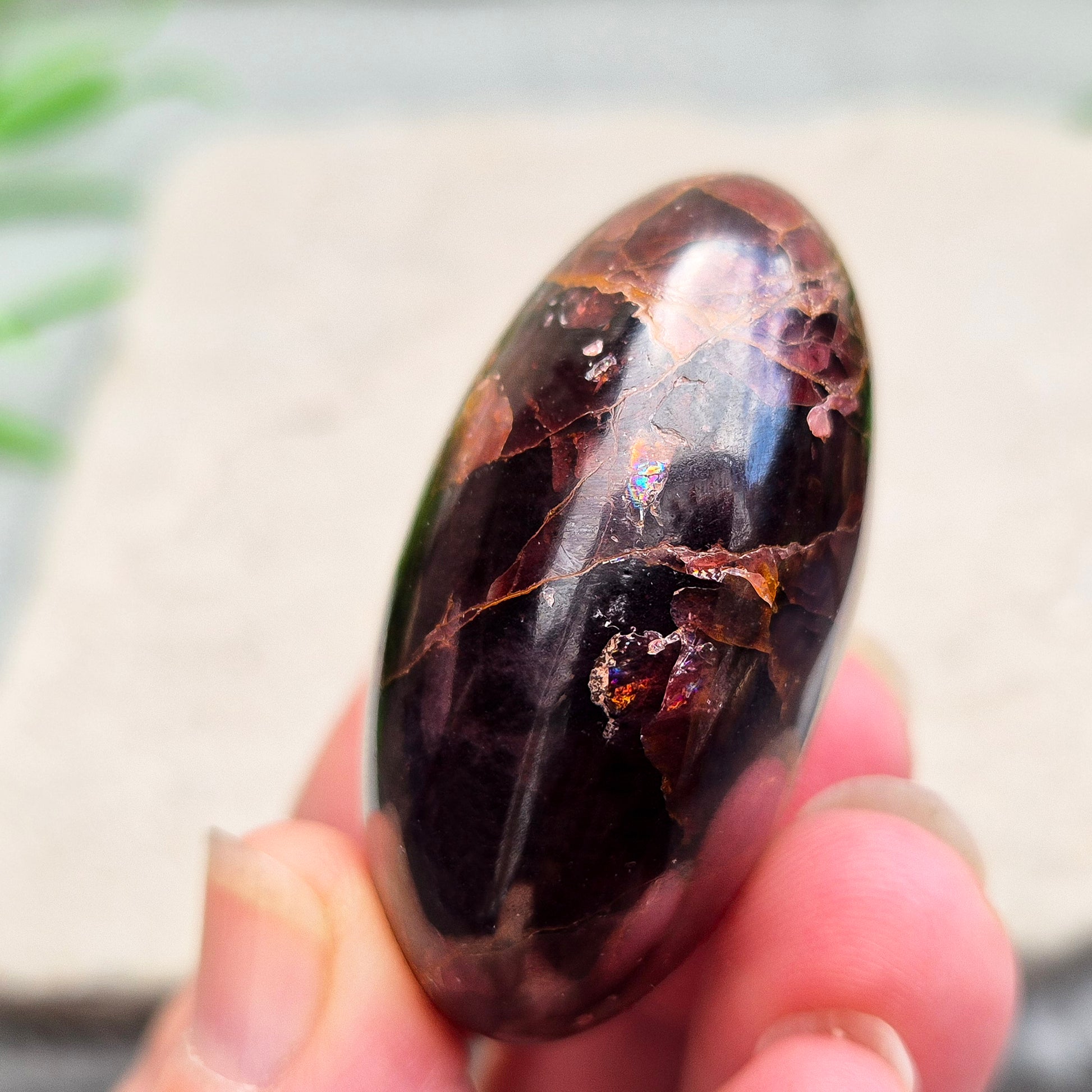 Rare Star Garnet palm stone with striking asterism. Perfect for collectors and crystal lovers seeking unique, grounding energy.