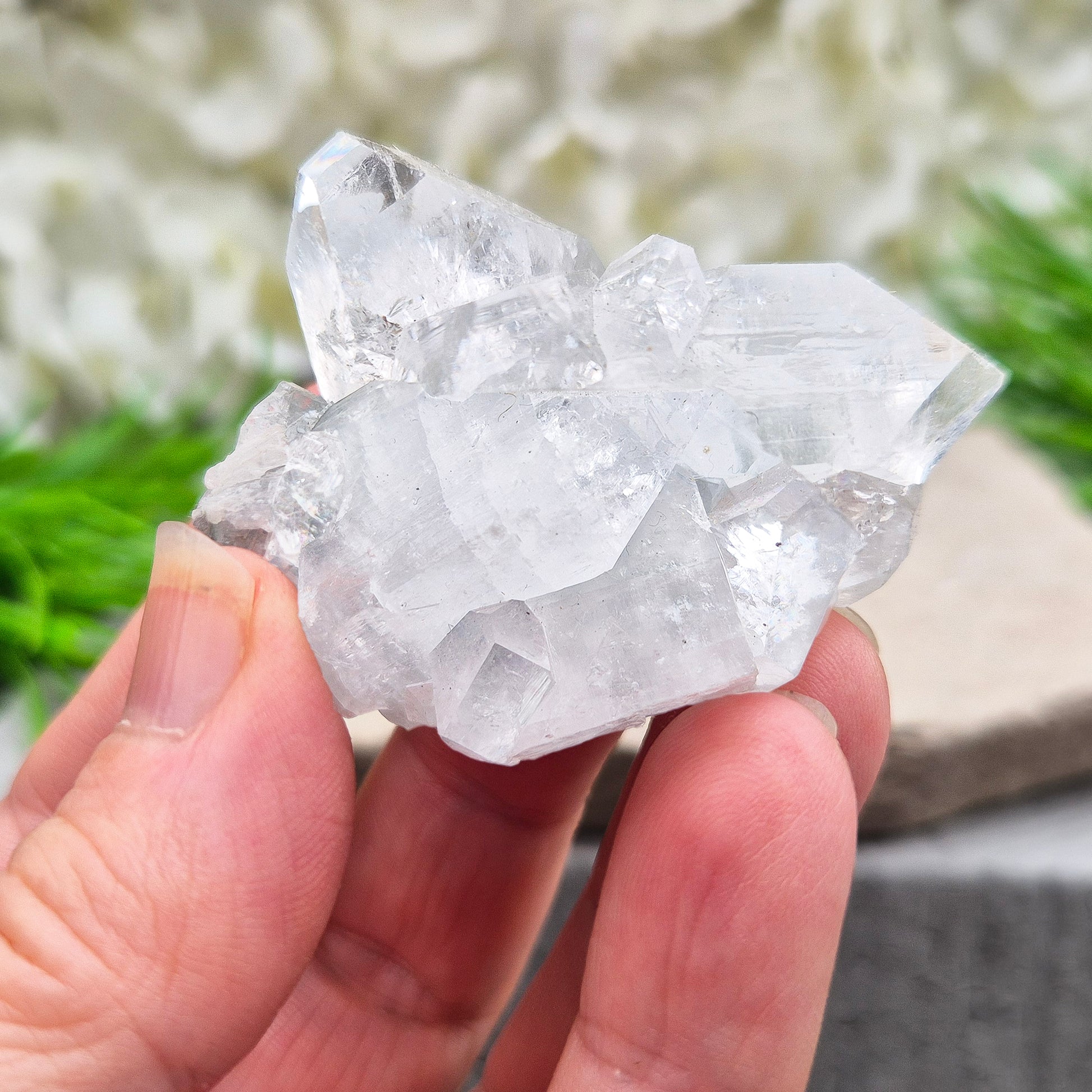 Apophyllite cluster with bright, sparkling points. A beautiful piece for uplifting energy, fresh space, and calm focus. Ideal for meditation or home décor.
