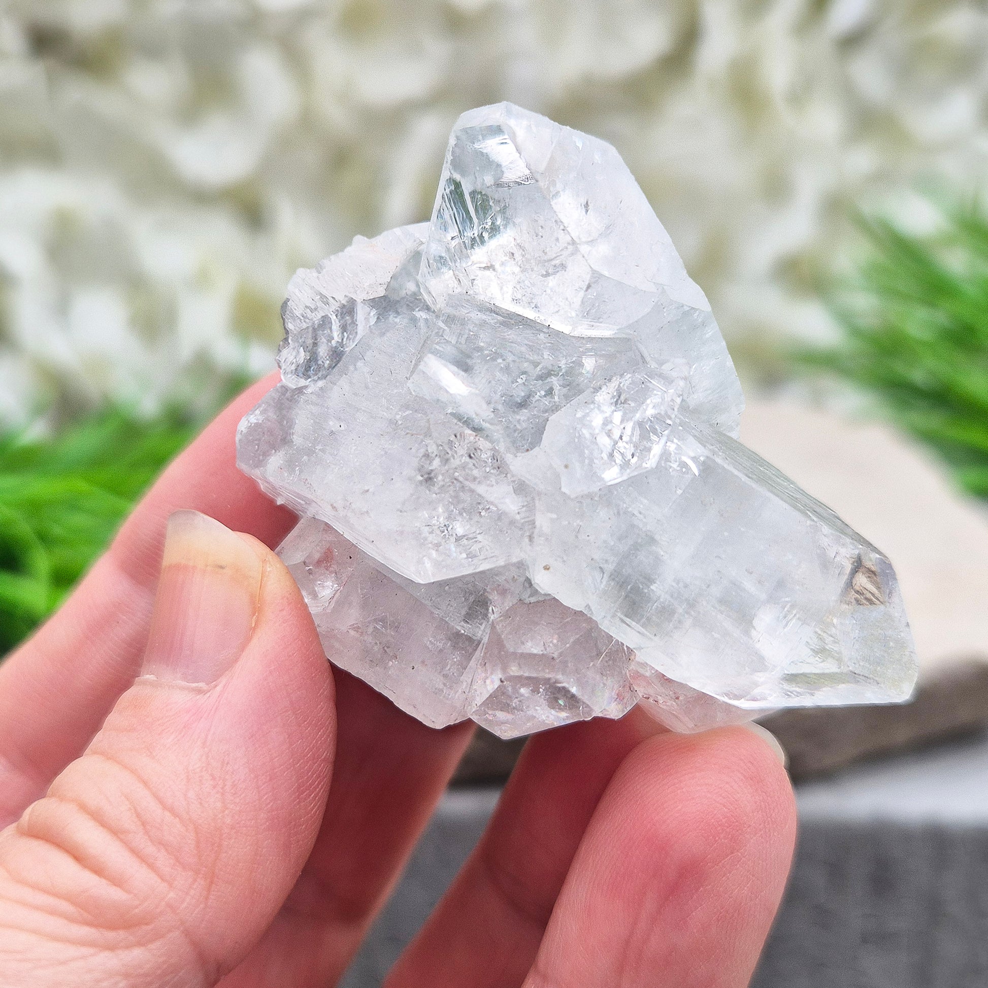 Apophyllite cluster with bright, sparkling points. A beautiful piece for uplifting energy, fresh space, and calm focus. Ideal for meditation or home décor.
