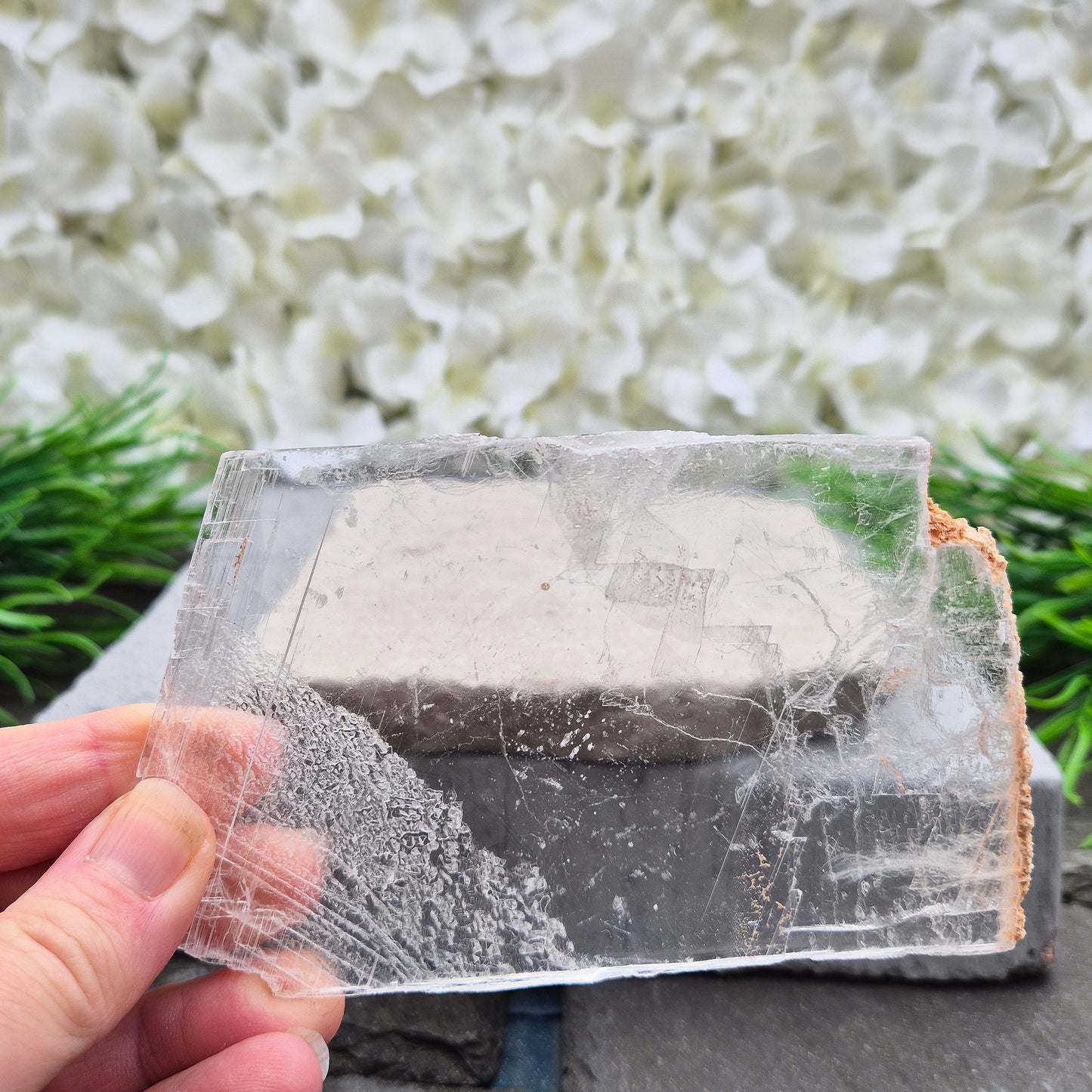 A natural gypsum window plate for cleansing and charging crystals. Clears stagnant energy, supports intuition, and keeps your space energetically fresh.
