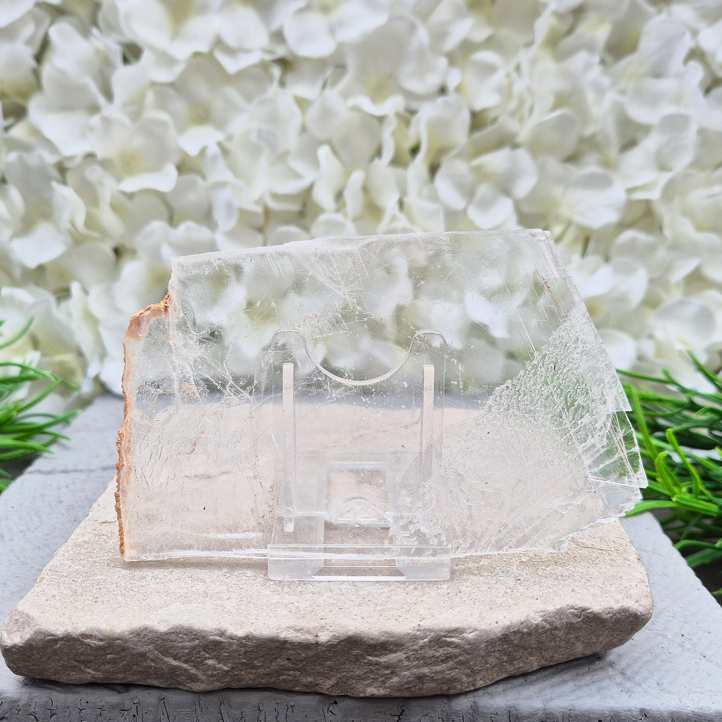 A natural gypsum window plate for cleansing and charging crystals. Clears stagnant energy, supports intuition, and keeps your space energetically fresh.