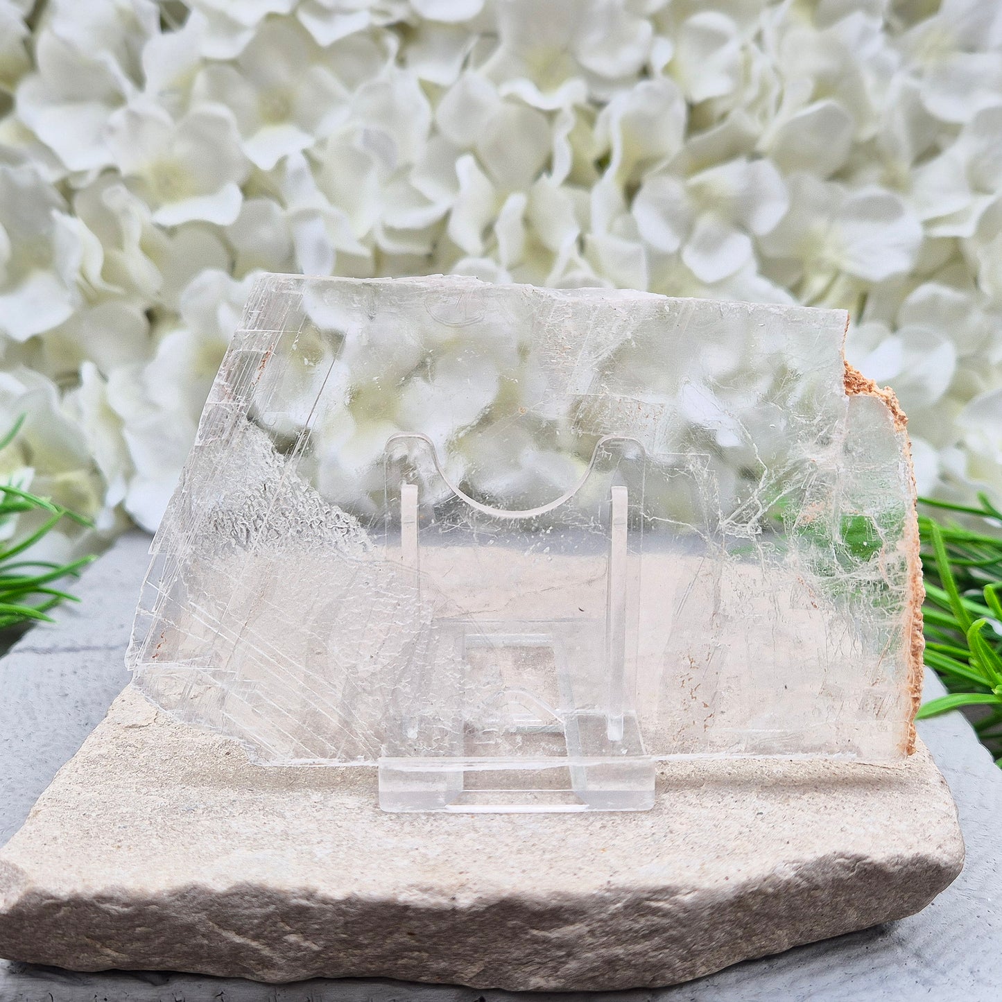 A natural gypsum window plate for cleansing and charging crystals. Clears stagnant energy, supports intuition, and keeps your space energetically fresh.