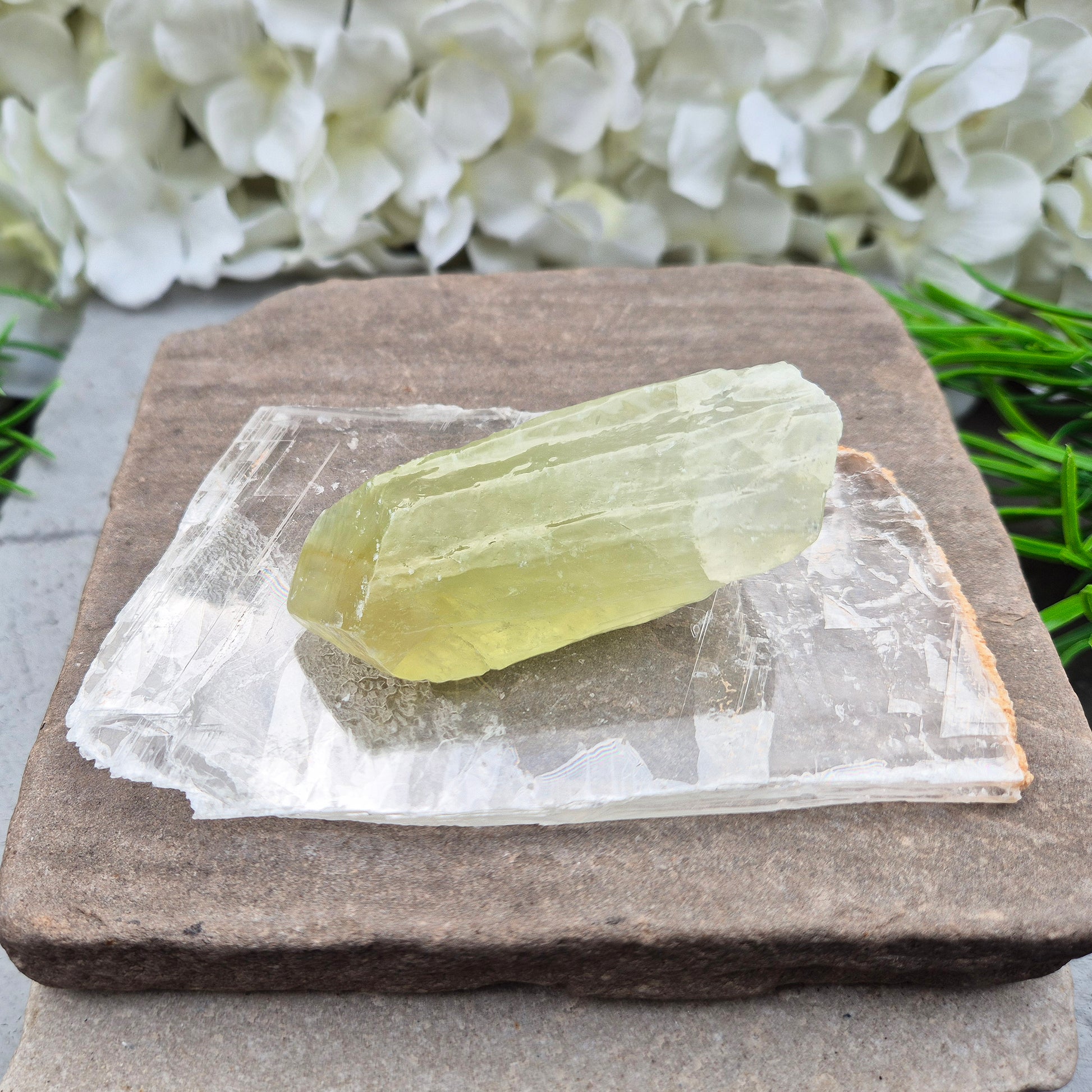 A natural gypsum window plate for cleansing and charging crystals. Clears stagnant energy, supports intuition, and keeps your space energetically fresh.