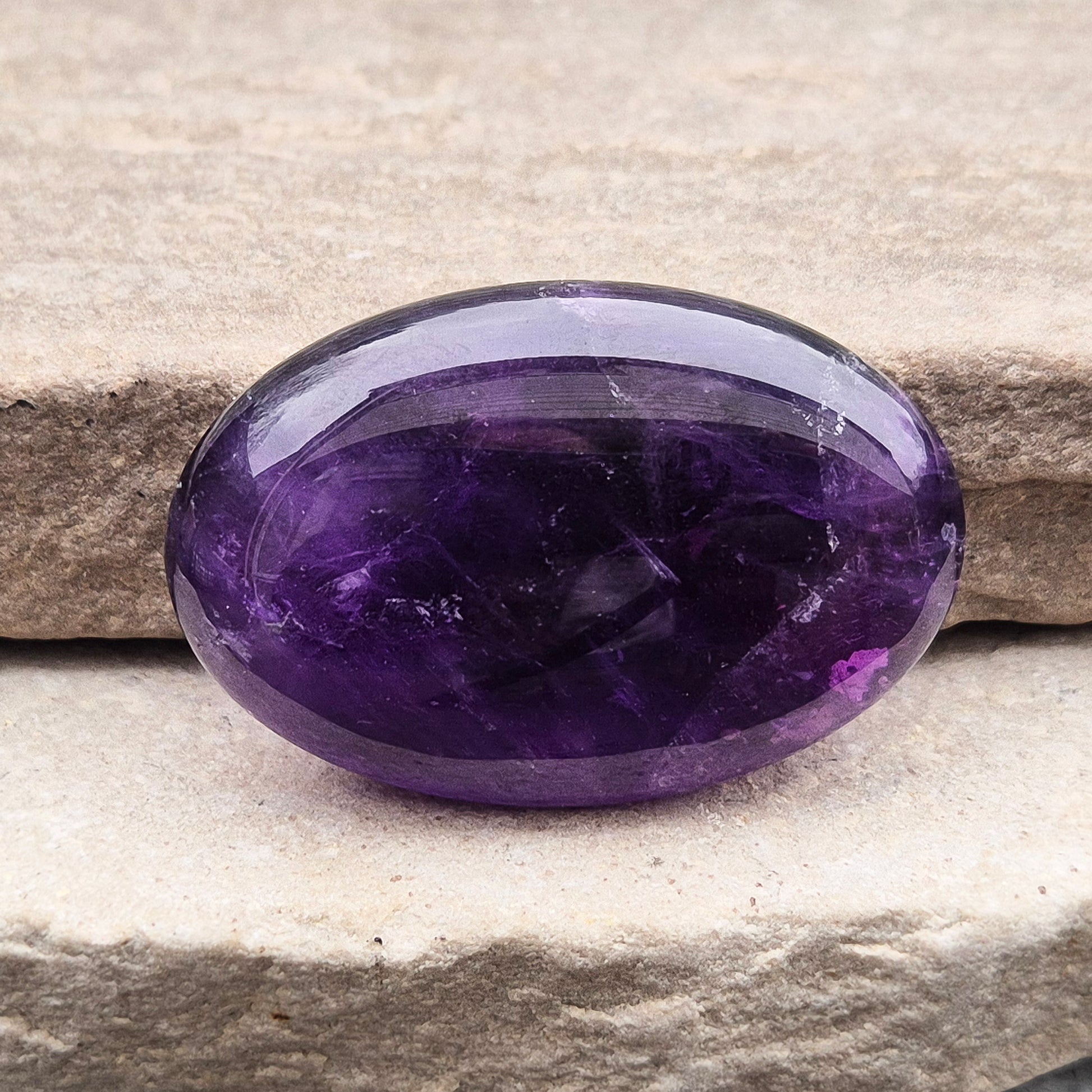 Amethyst Palm Stone with deep purple tones. A soothing crystal for balance, peaceful energy, and gentle spiritual connection.