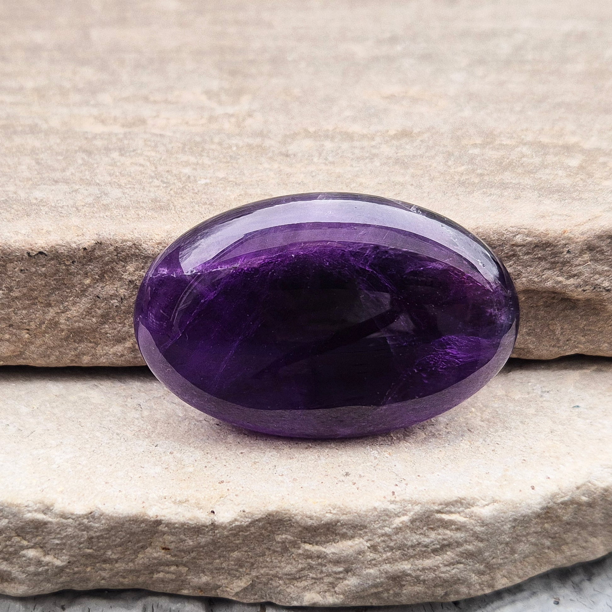 Amethyst Palm Stone with deep purple tones. A soothing crystal for balance, peaceful energy, and gentle spiritual connection.