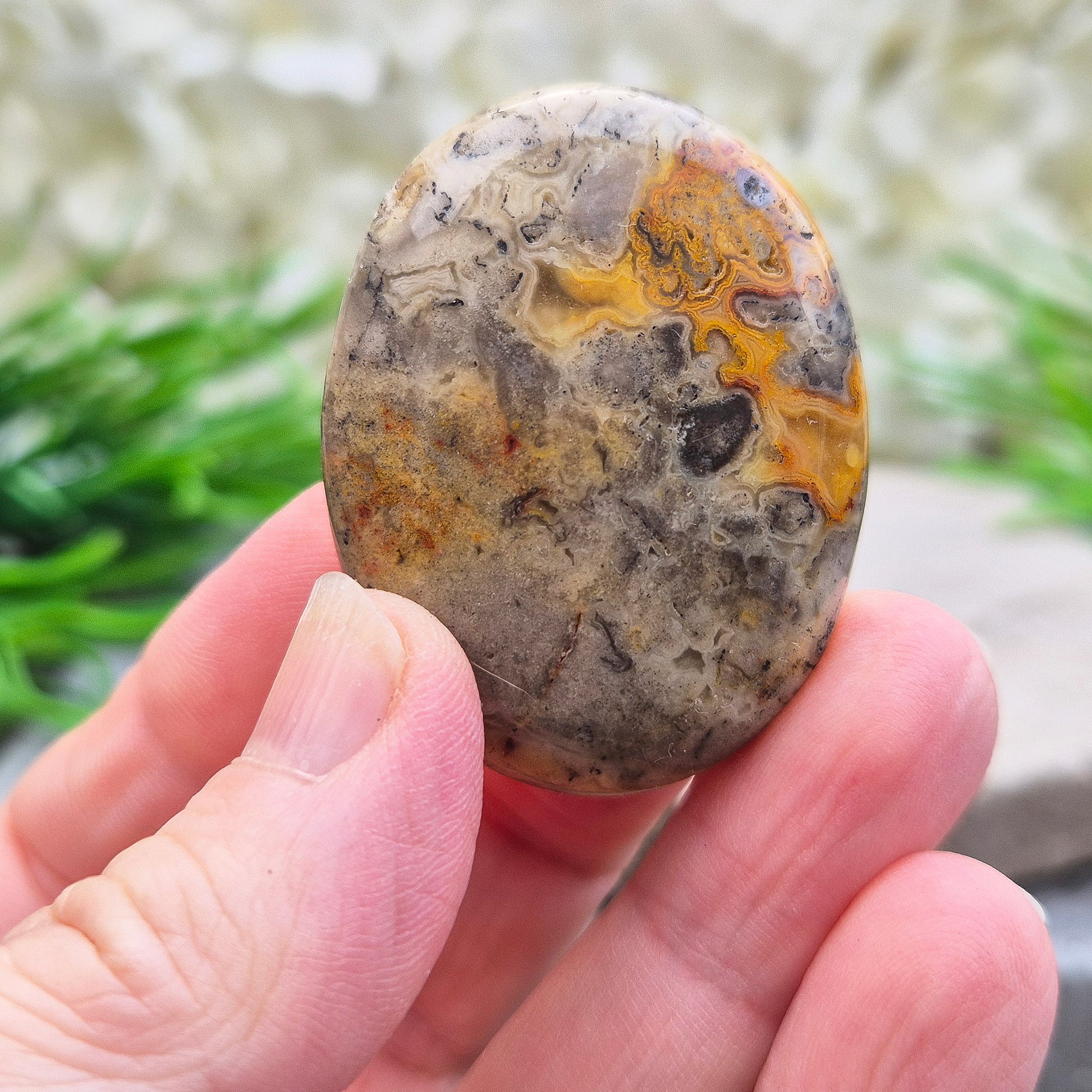 Discover natural Crazy Lace Agate palm stones from Mexico. Known for uplifting, grounding energy, optimism, emotional balance, and everyday positivity.