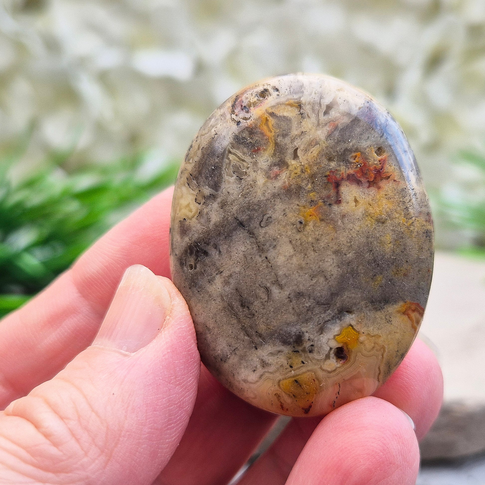Discover natural Crazy Lace Agate palm stones from Mexico. Known for uplifting, grounding energy, optimism, emotional balance, and everyday positivity.