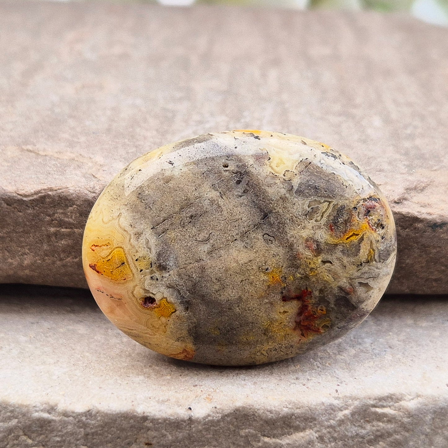 Discover natural Crazy Lace Agate palm stones from Mexico. Known for uplifting, grounding energy, optimism, emotional balance, and everyday positivity.