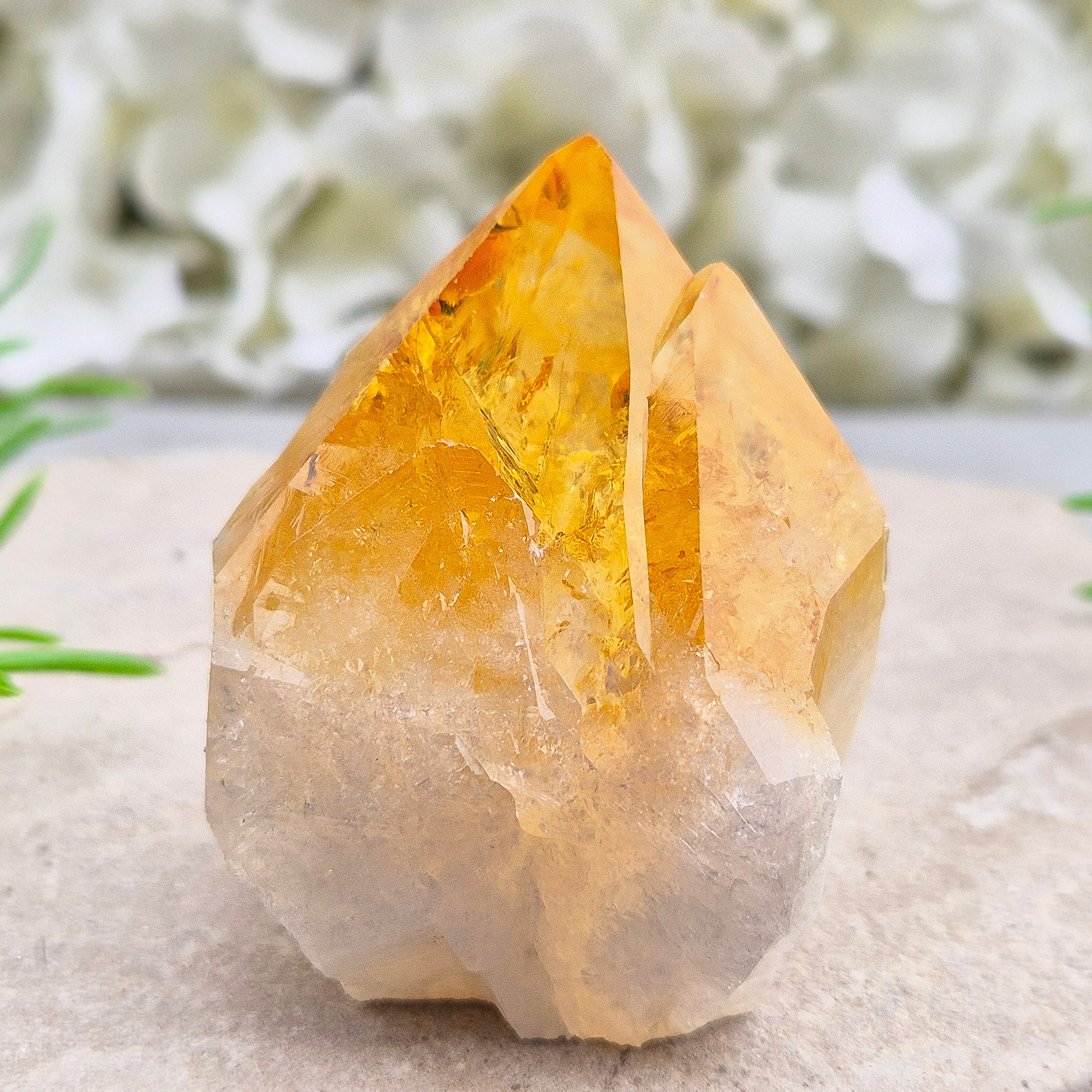 Citrine crystal standing point from Brazil with a polished tip and natural sides. Associated with confidence, motivation, positivity, and personal growth.