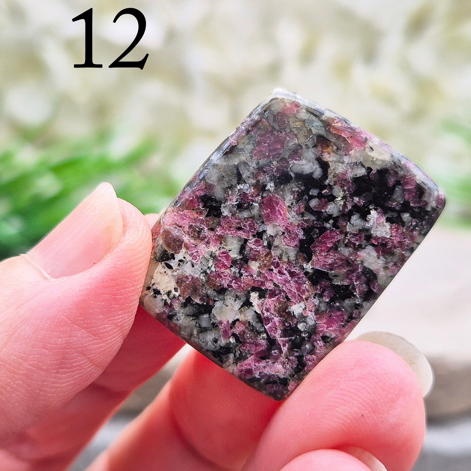 Polished Eudialyte flat stone from Greenland with rich red and pink tones. Associated with emotional steadiness, heart support, and grounded change.
