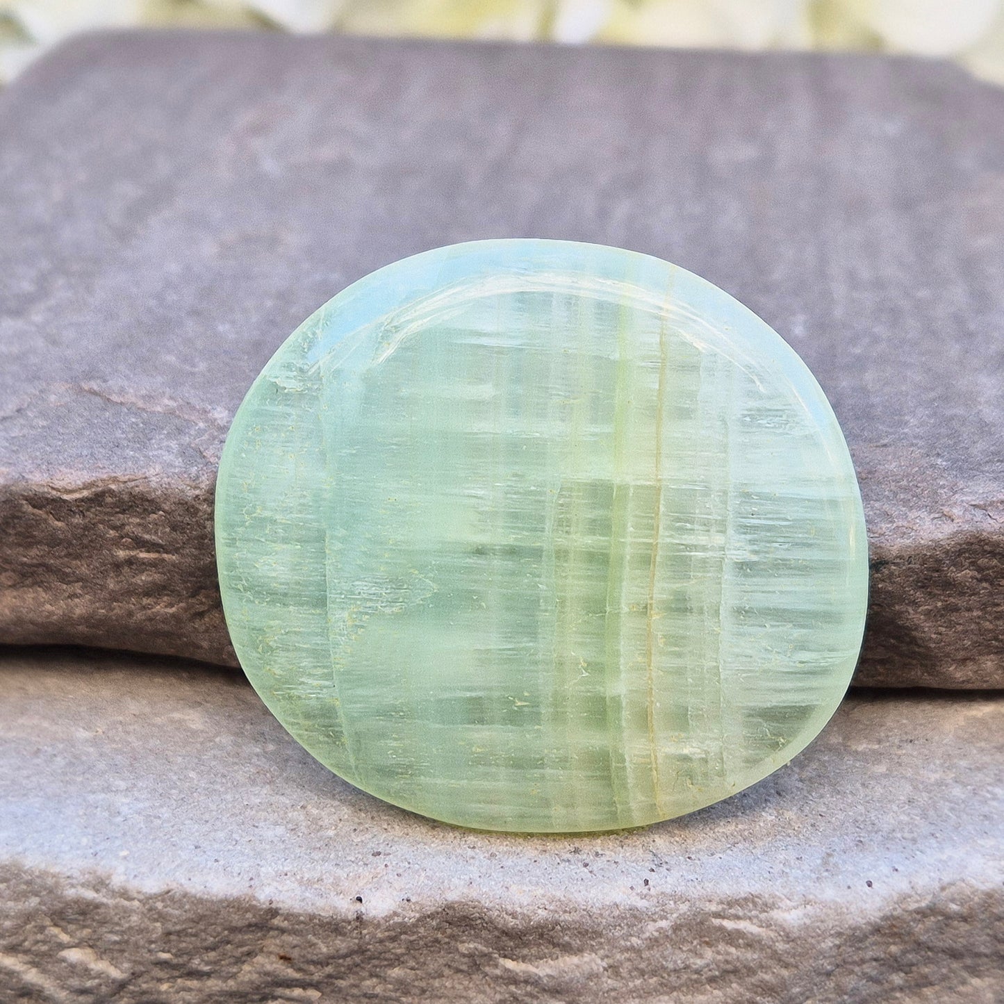 Pistachio Calcite palm stone from Pakistan with soft green tones. A calming crystal for emotional balance, stress relief, and gentle heart-led energy.