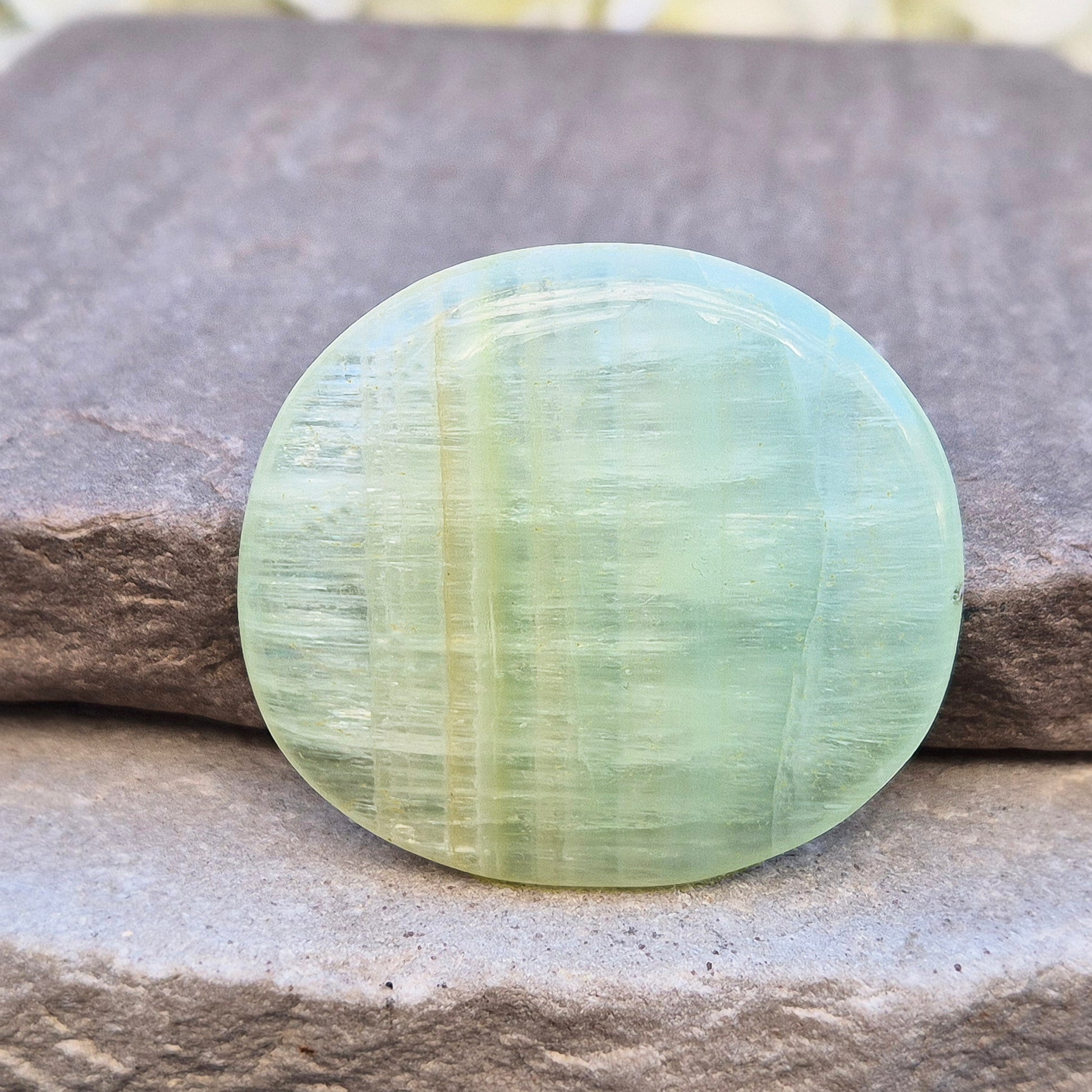 Pistachio Calcite palm stone from Pakistan with soft green tones. A calming crystal for emotional balance, stress relief, and gentle heart-led energy.