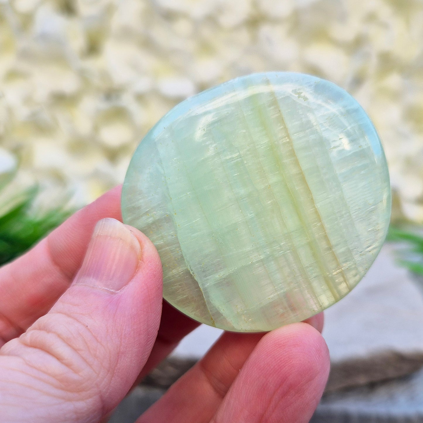 Pistachio Calcite palm stone from Pakistan with soft green tones. A calming crystal for emotional balance, stress relief, and gentle heart-led energy.