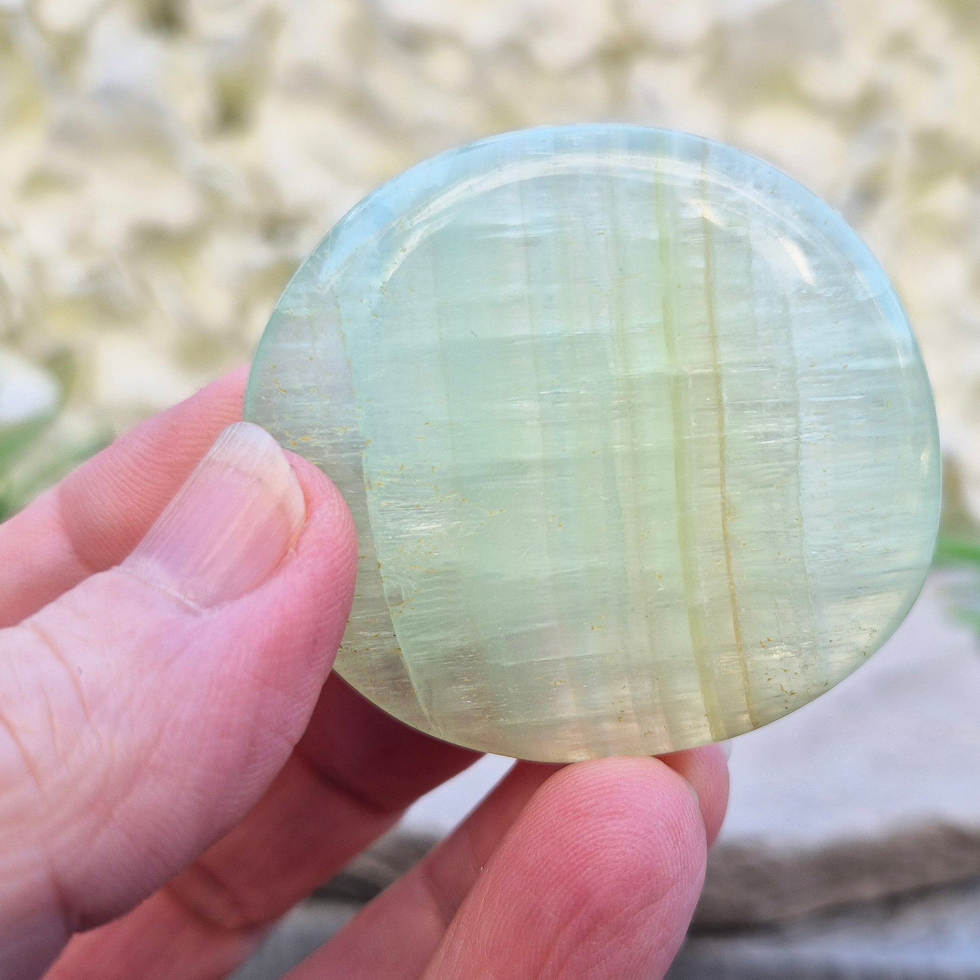 Pistachio Calcite palm stone from Pakistan with soft green tones. A calming crystal for emotional balance, stress relief, and gentle heart-led energy.