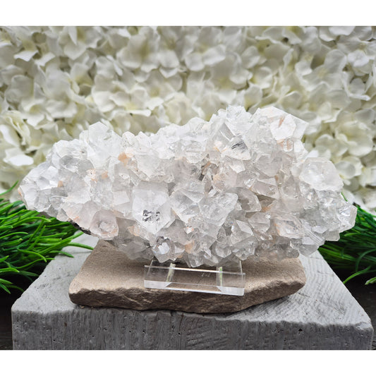Natural Apophyllite crystal cluster from India, known for its calm, uplifting presence. A beautiful display piece often chosen for reflection and spiritual spaces.