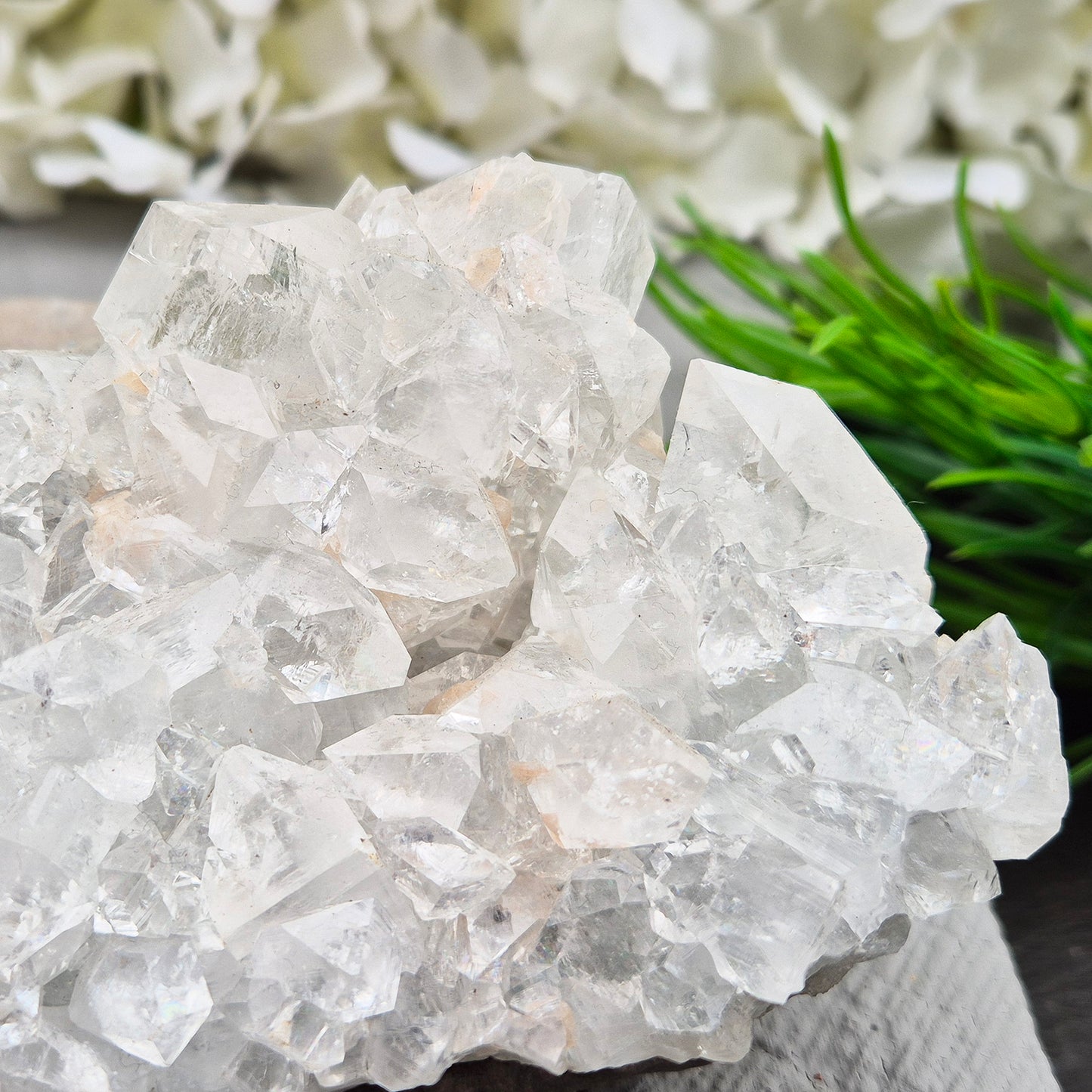 Natural Apophyllite crystal cluster from India, known for its calm, uplifting presence. A beautiful display piece often chosen for reflection and spiritual spaces.