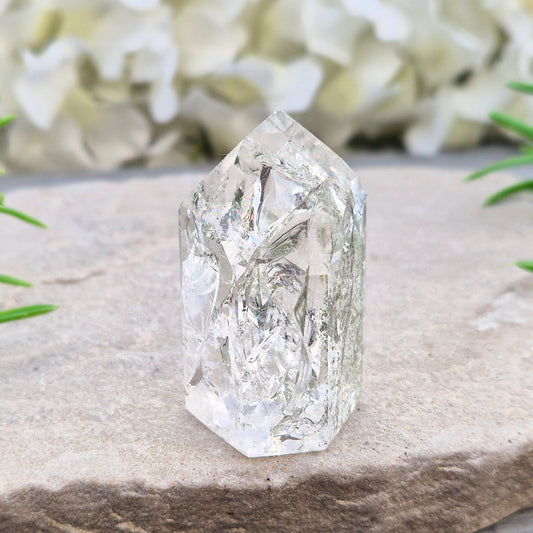 Fire and Ice Quartz standing point from Brazil, also known as Rainbow Quartz. Polished finish with reflective inclusions and subtle rainbow flashes.