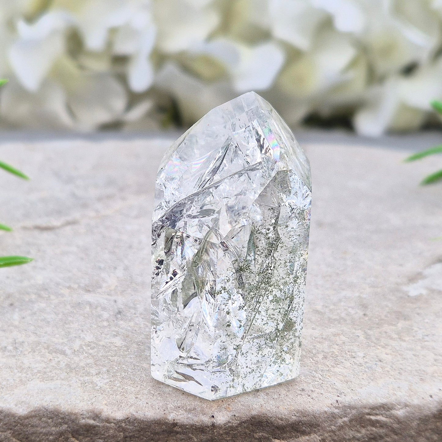 Fire and Ice Quartz standing point from Brazil, also known as Rainbow Quartz. Polished finish with reflective inclusions and subtle rainbow flashes.