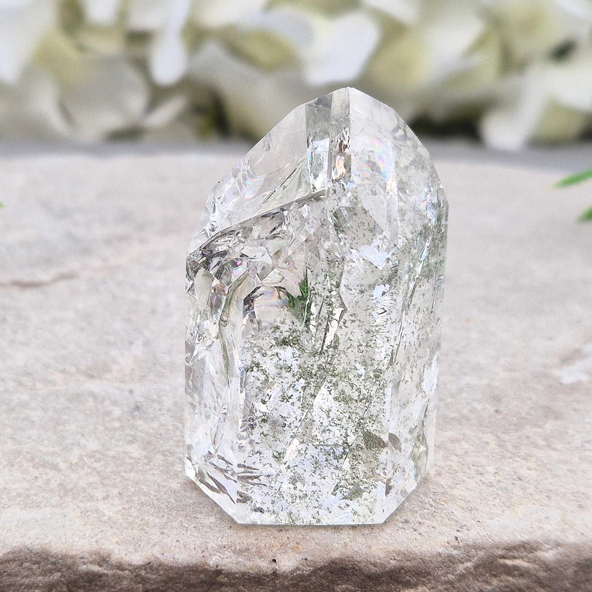 Fire and Ice Quartz standing point from Brazil, also known as Rainbow Quartz. Polished finish with reflective inclusions and subtle rainbow flashes.