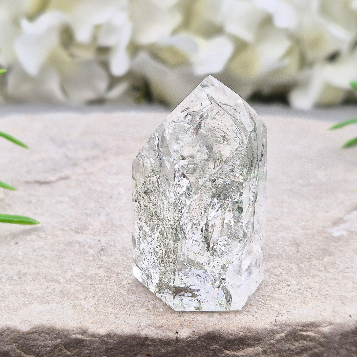 Fire and Ice Quartz standing point from Brazil, also known as Rainbow Quartz. Polished finish with reflective inclusions and subtle rainbow flashes.