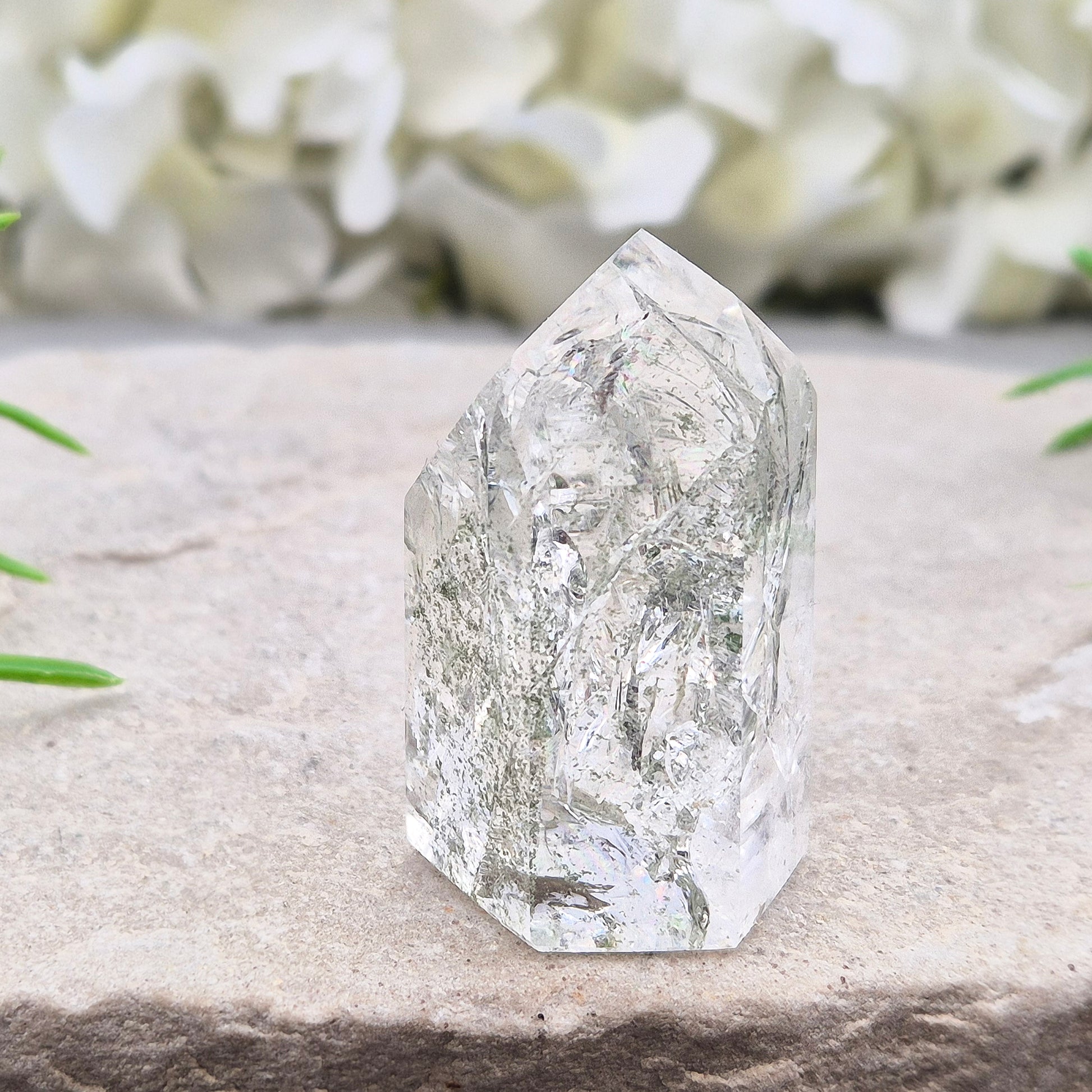 Fire and Ice Quartz standing point from Brazil, also known as Rainbow Quartz. Polished finish with reflective inclusions and subtle rainbow flashes.