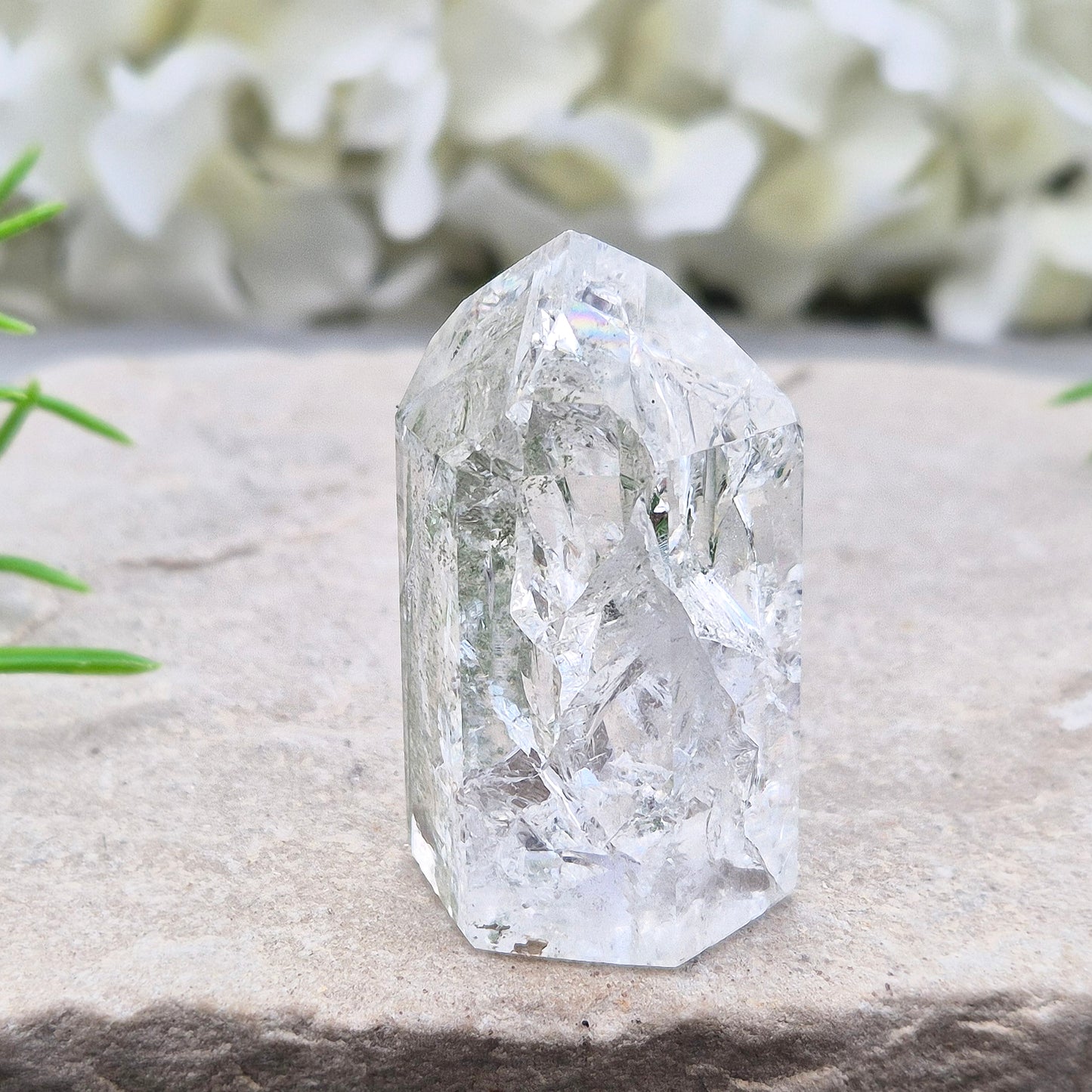 Fire and Ice Quartz standing point from Brazil, also known as Rainbow Quartz. Polished finish with reflective inclusions and subtle rainbow flashes.