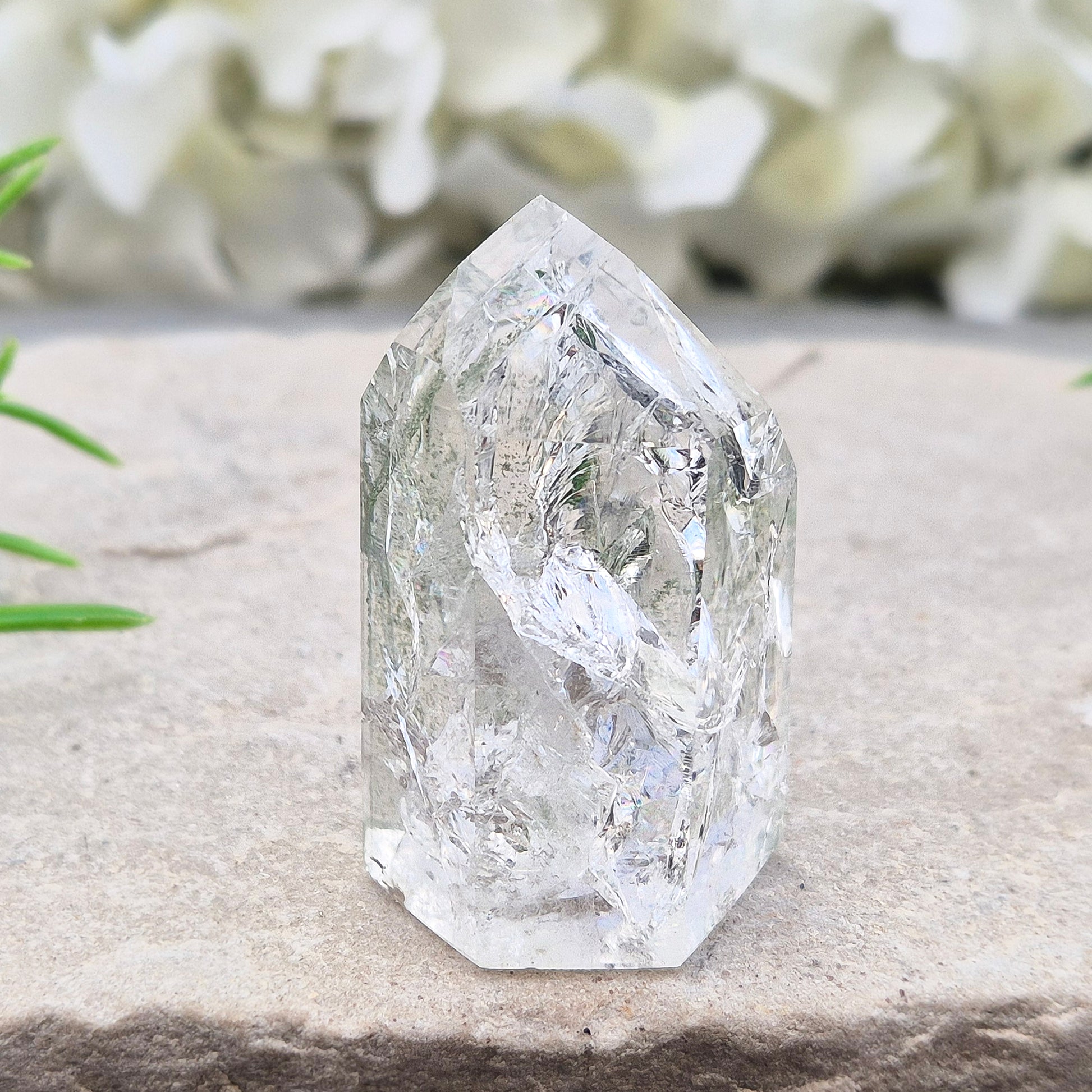 Fire and Ice Quartz standing point from Brazil, also known as Rainbow Quartz. Polished finish with reflective inclusions and subtle rainbow flashes.