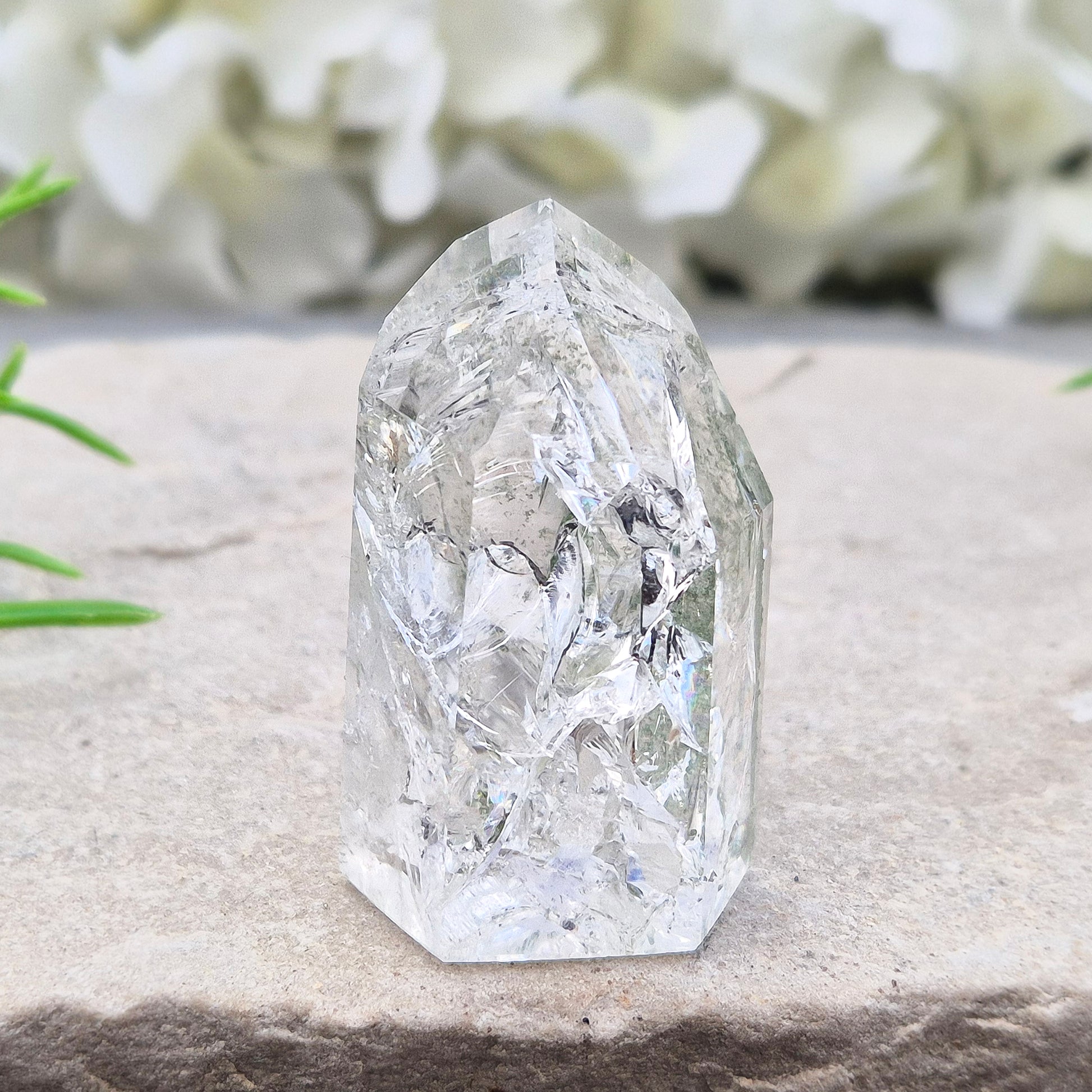 Fire and Ice Quartz standing point from Brazil, also known as Rainbow Quartz. Polished finish with reflective inclusions and subtle rainbow flashes.