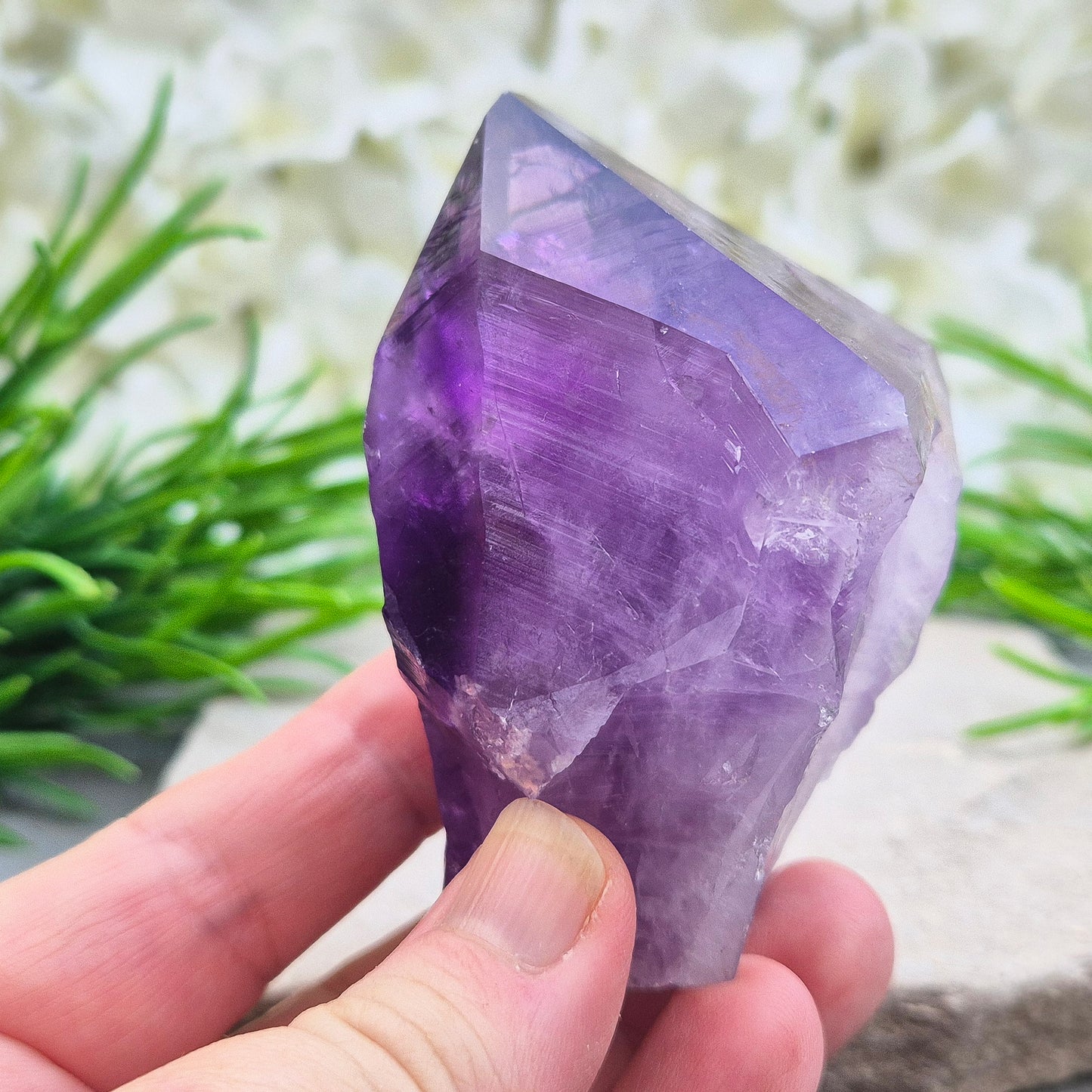 Brazilian Amethyst standing point with natural sides and polished tip. A popular calming crystal for stress relief and quiet reflection spaces.
