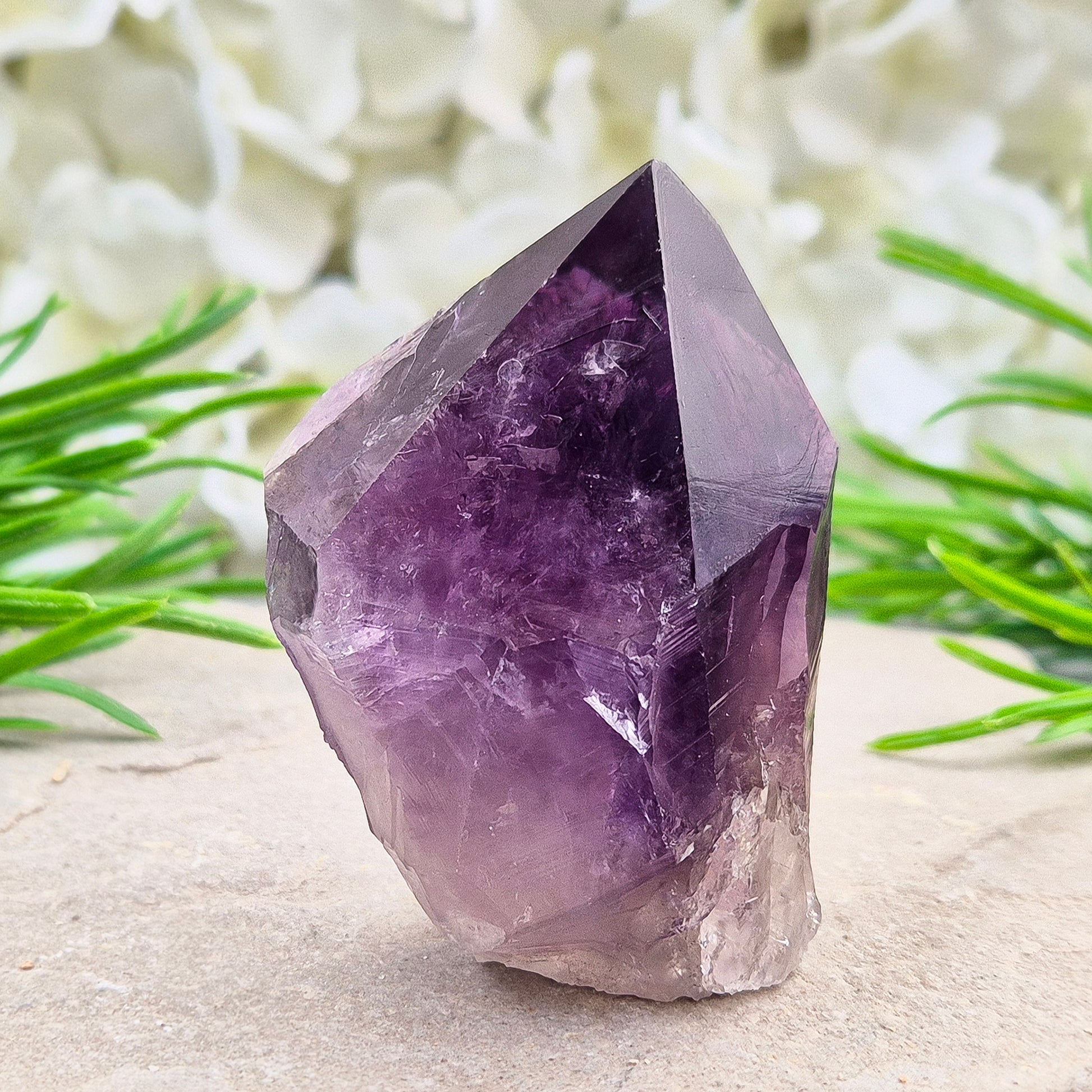 Deep purple Amethyst standing point with polished tip. A calming crystal for bedrooms, desks, and peaceful personal spaces.