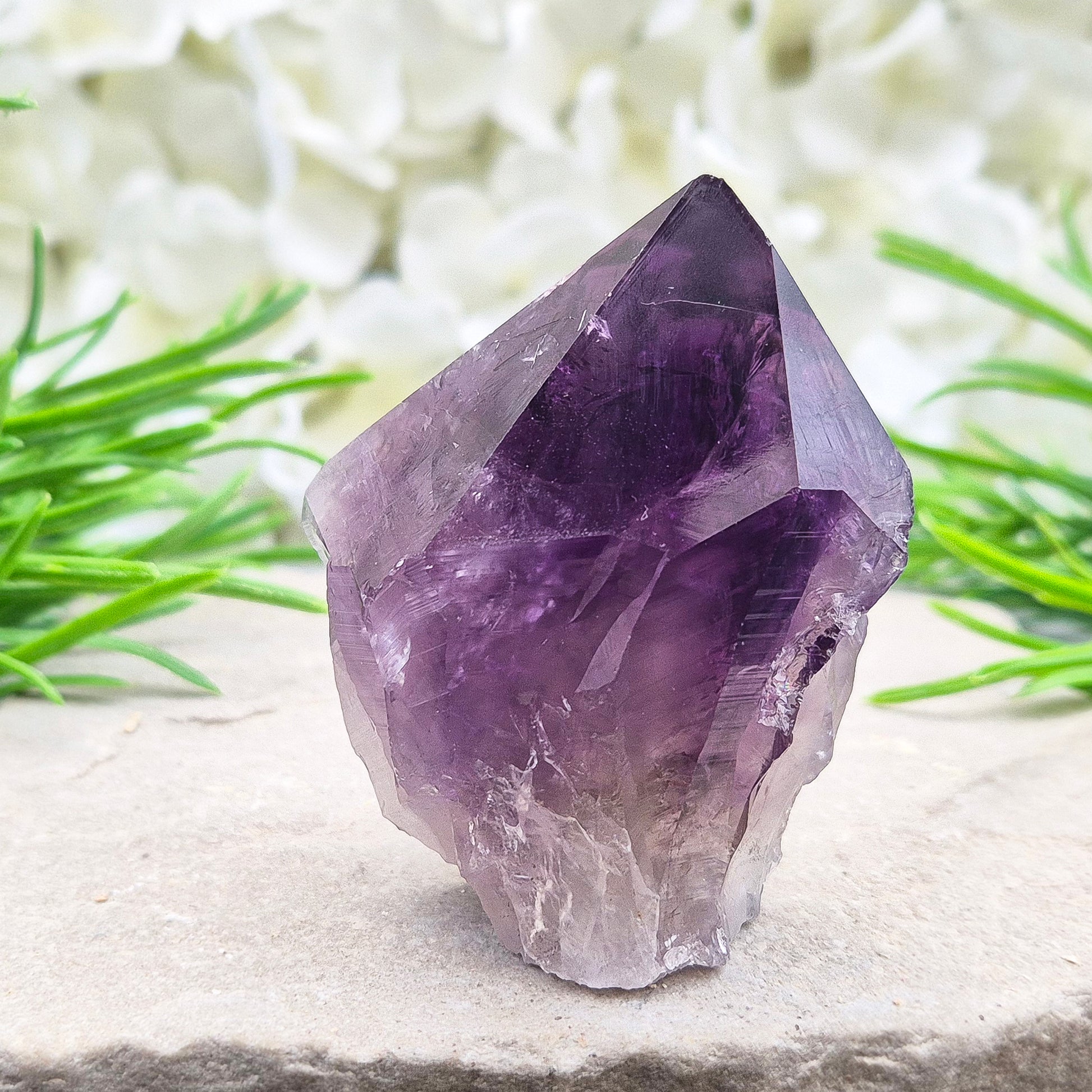 Deep purple Amethyst standing point with polished tip. A calming crystal for bedrooms, desks, and peaceful personal spaces.