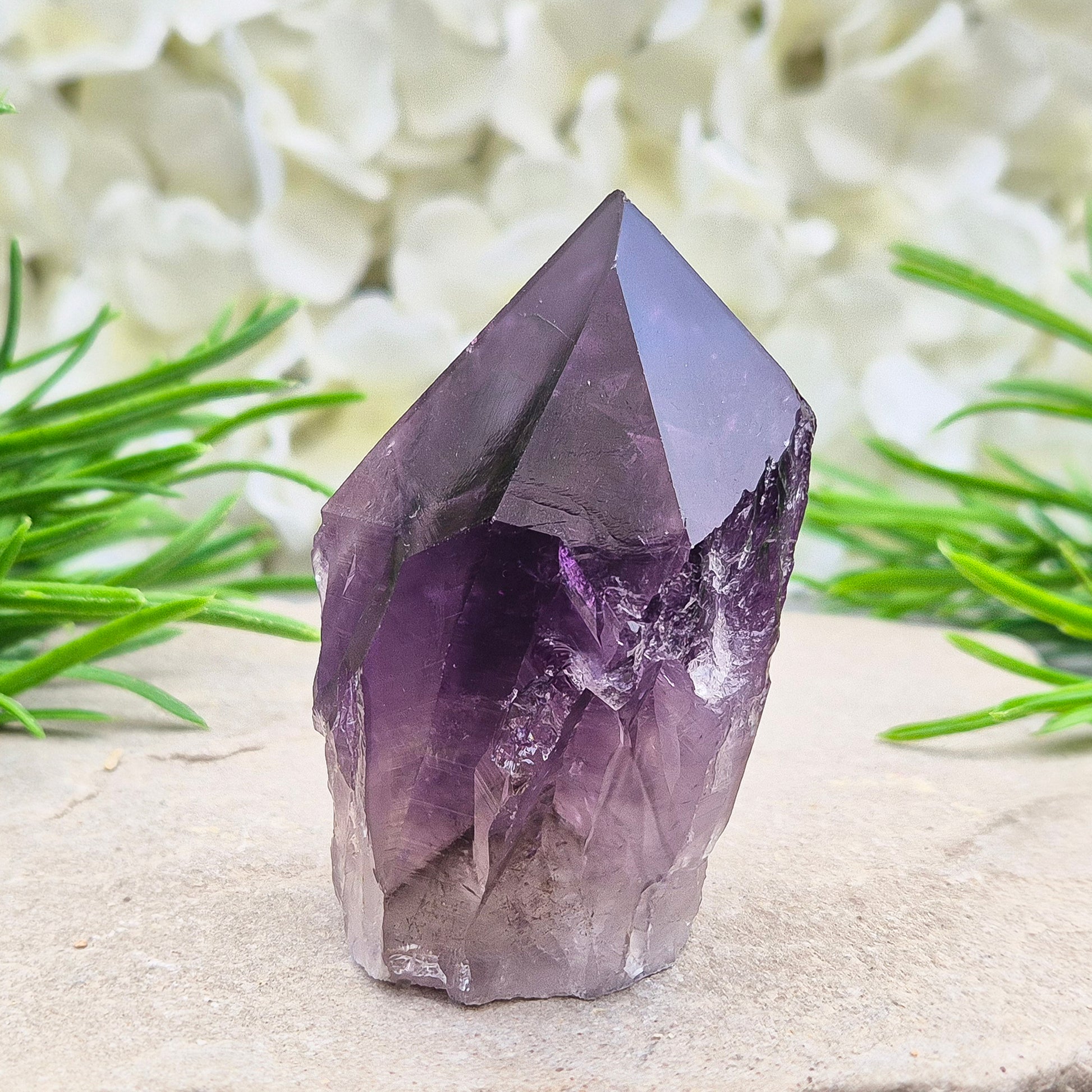 Deep purple Amethyst standing point with polished tip. A calming crystal for bedrooms, desks, and peaceful personal spaces.