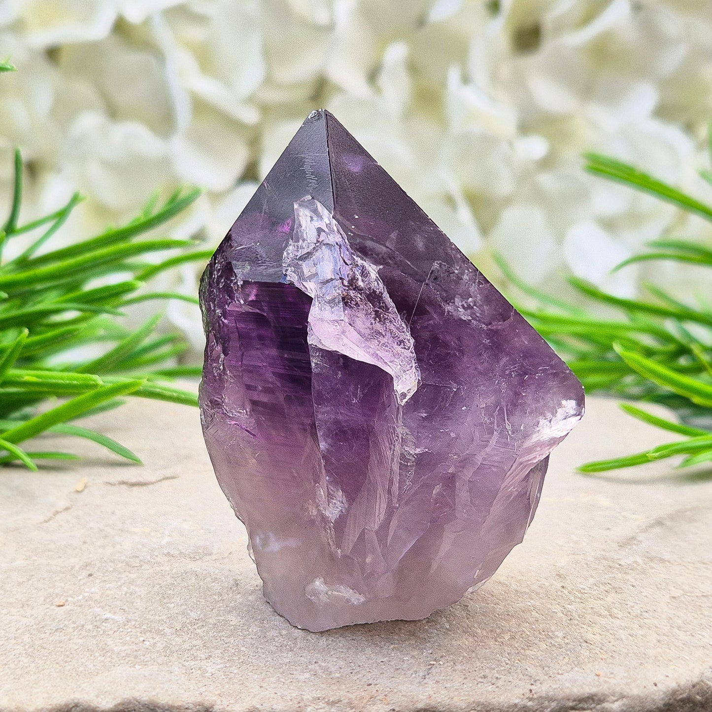 Deep purple Amethyst standing point with polished tip. A calming crystal for bedrooms, desks, and peaceful personal spaces.