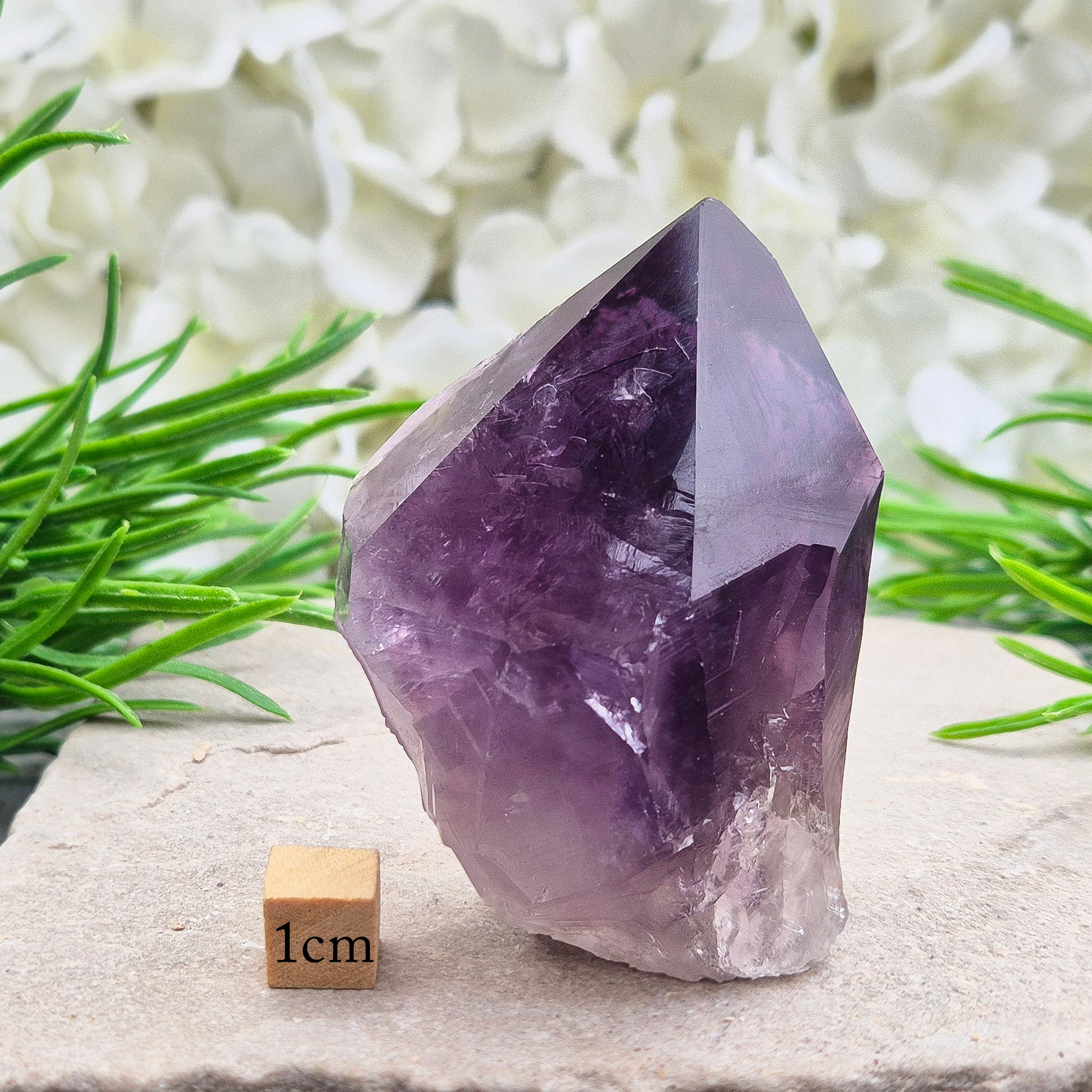 Deep purple Amethyst standing point with polished tip. A calming crystal for bedrooms, desks, and peaceful personal spaces.