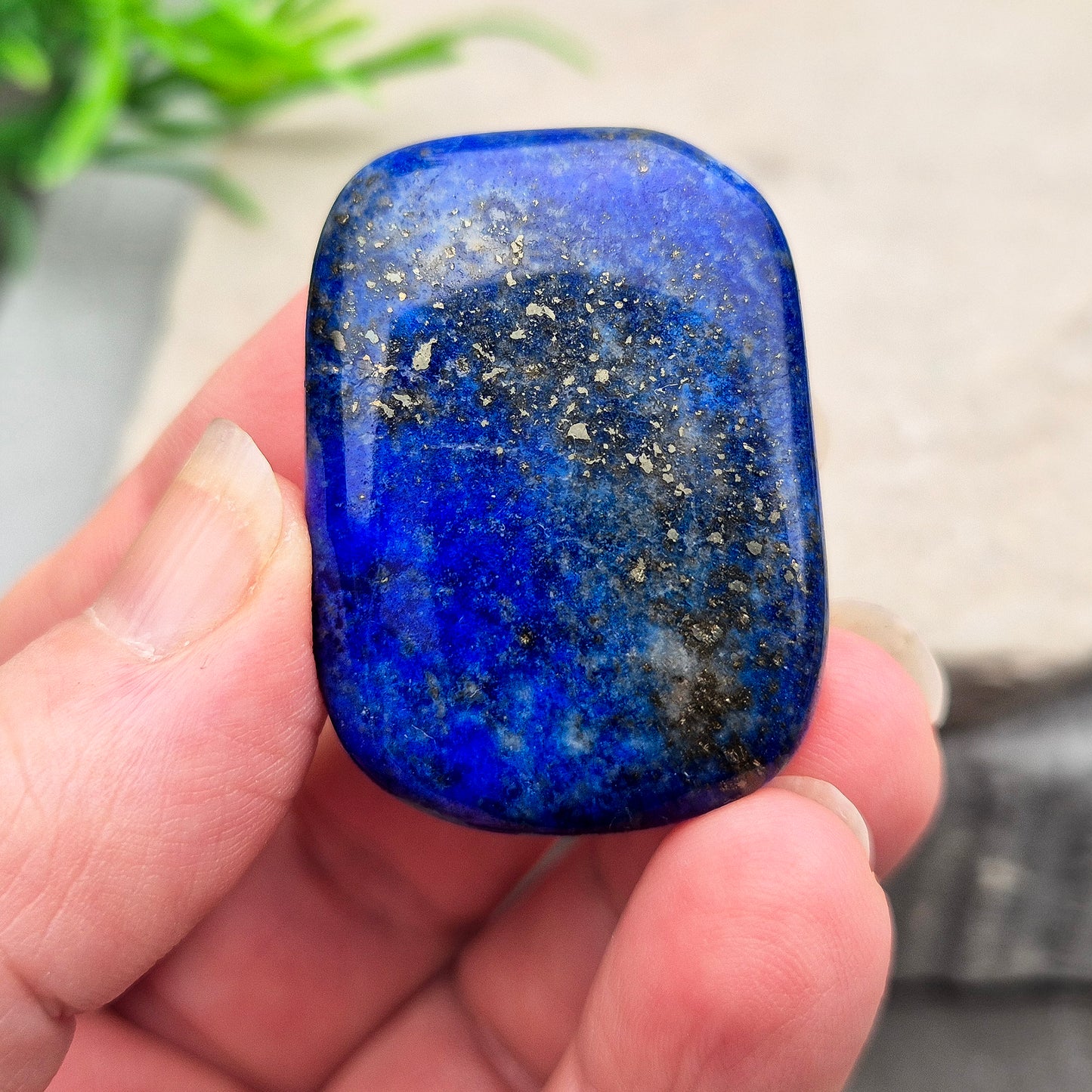 Rectangle Lapis Lazuli palm stone with deep royal blue colour and natural gold flecks. A calming crystal for confidence, communication, and thoughtful reflection.