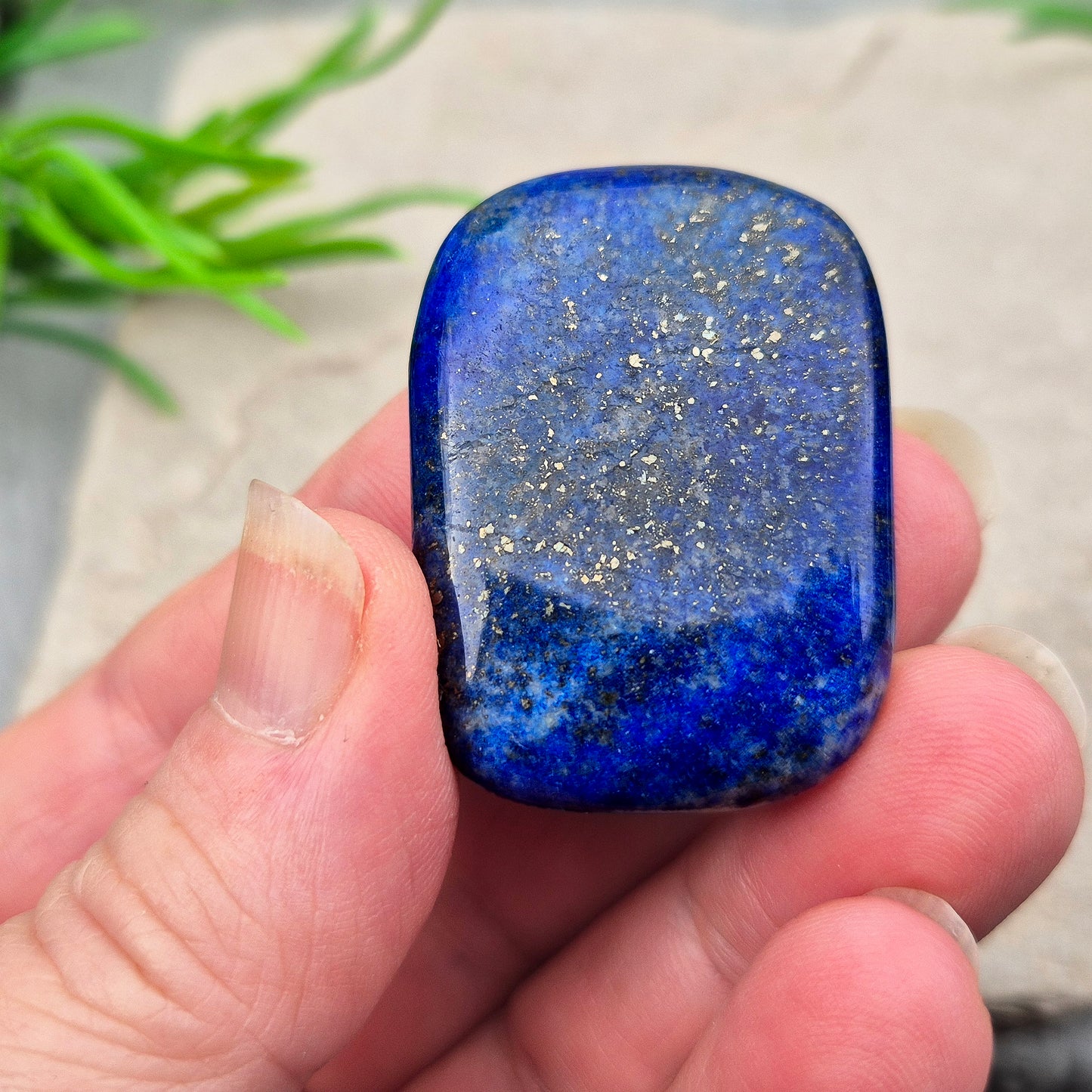 Rectangle Lapis Lazuli palm stone with deep royal blue colour and natural gold flecks. A calming crystal for confidence, communication, and thoughtful reflection.