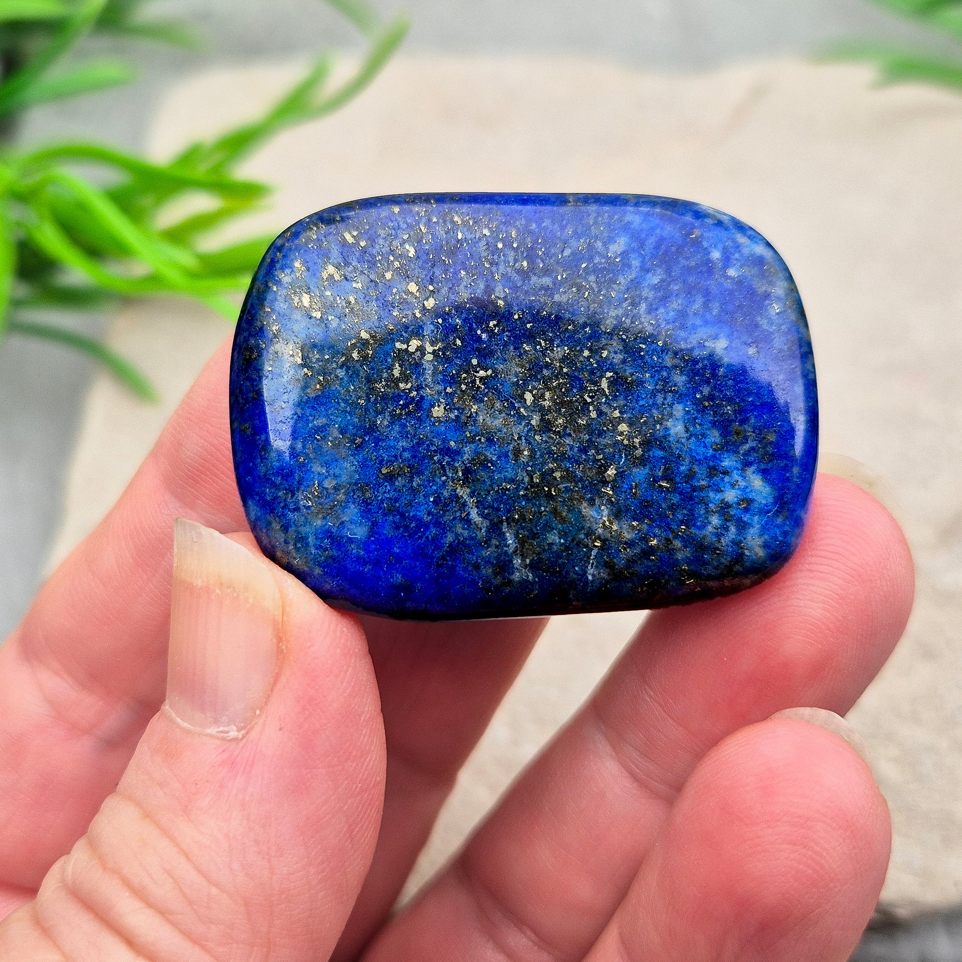 Rectangle Lapis Lazuli palm stone with deep royal blue colour and natural gold flecks. A calming crystal for confidence, communication, and thoughtful reflection.