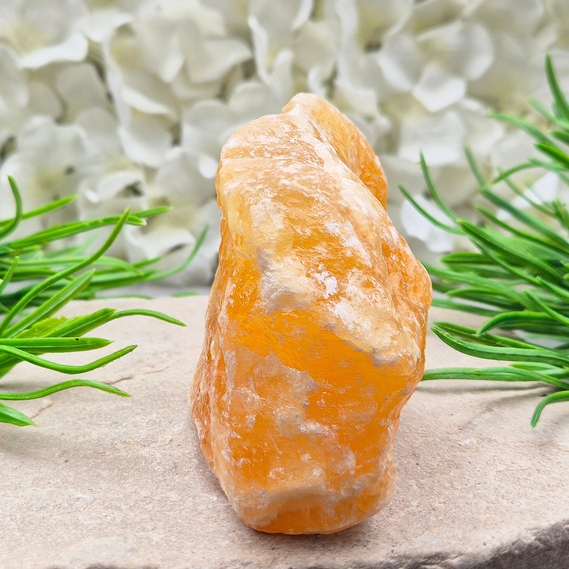 Natural Orange Calcite standing stone from Mexico. A warm, uplifting crystal for motivation, confidence, and brighter, more energised spaces.